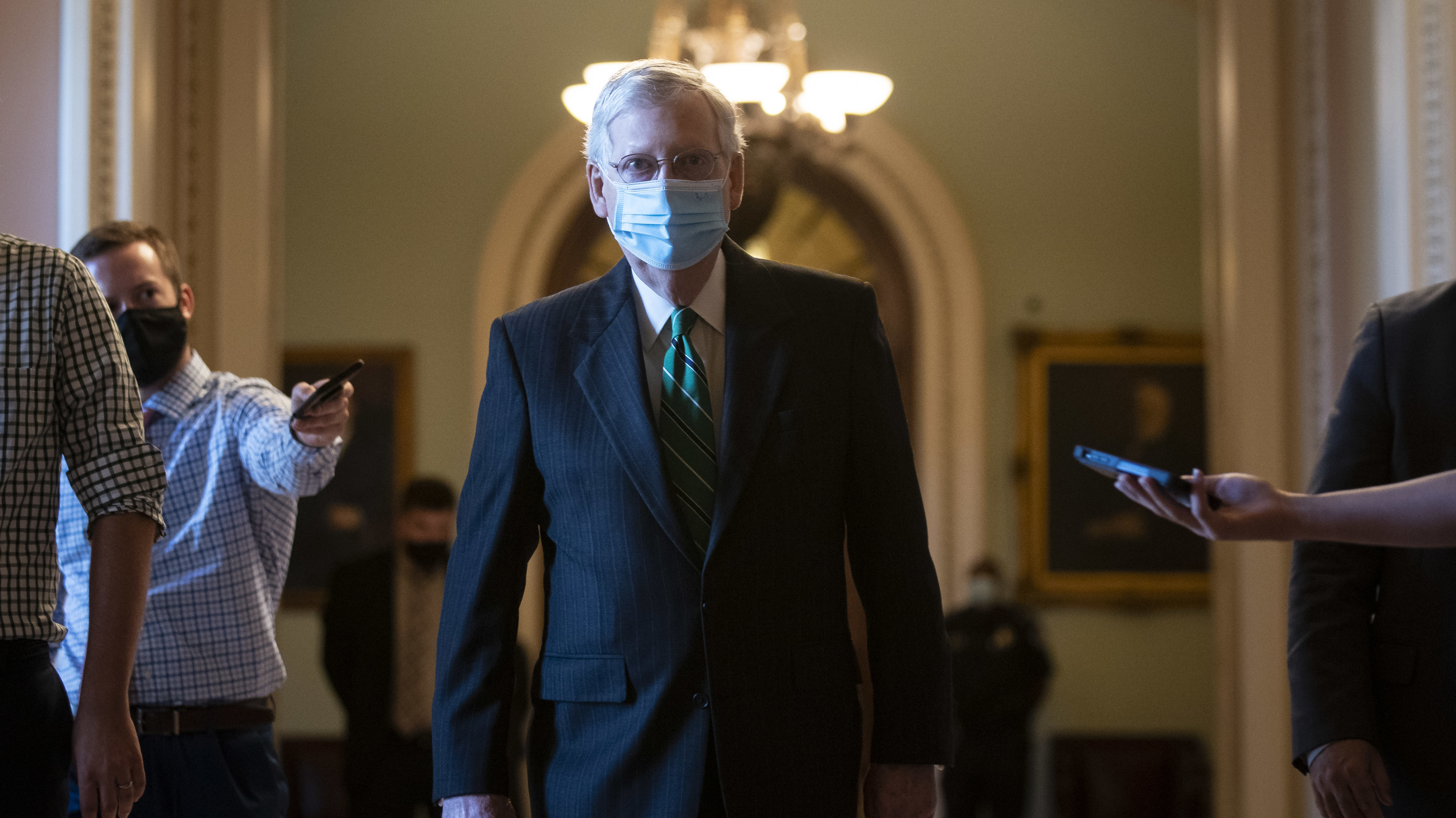 Senate Majority Leader Mitch McConnell walks back to his office after delivering opening remarks at the U.S Capitol on Wednesday.