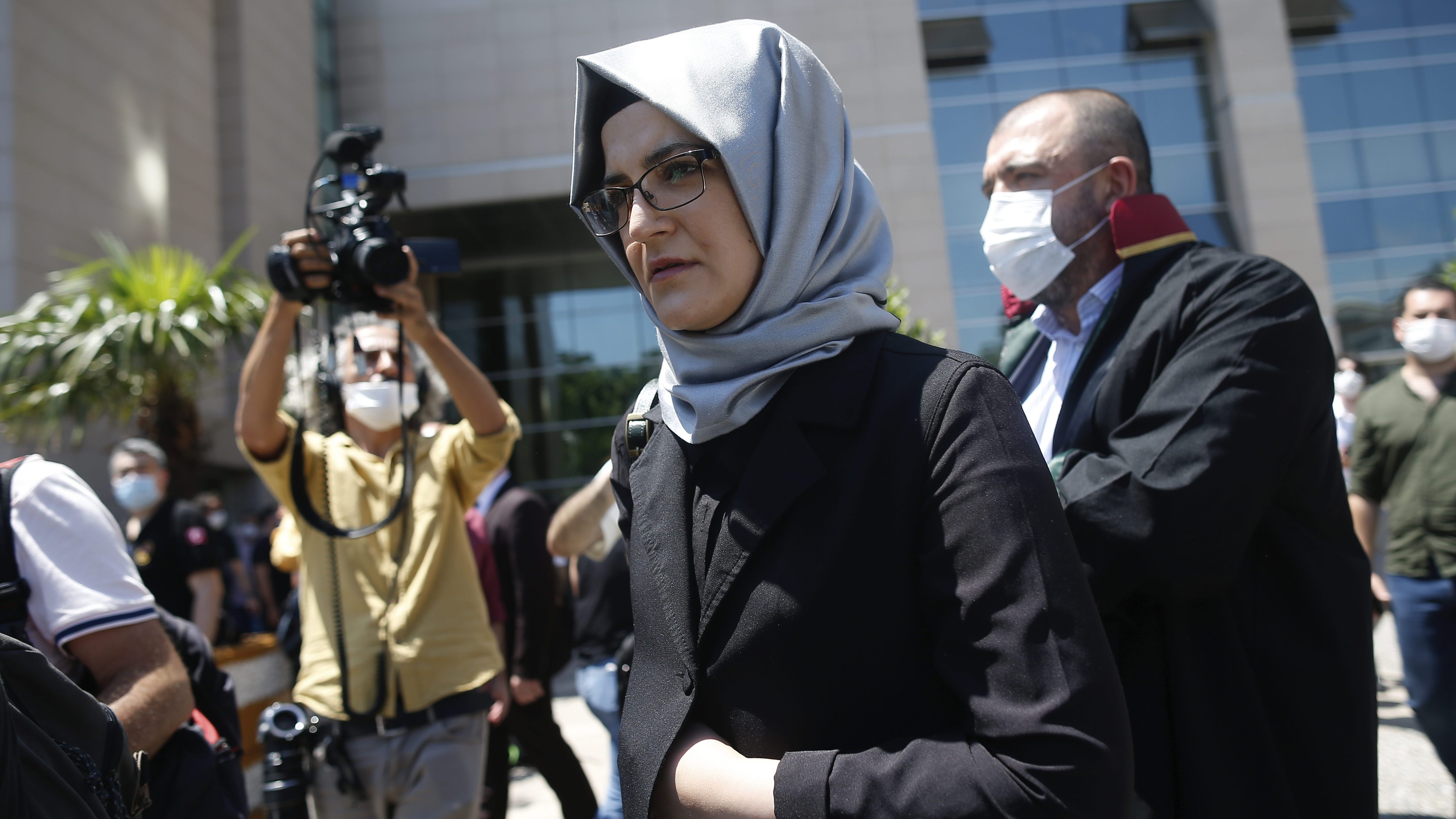 Hatice Cengiz, who was engaged to slain Saudi journalist Jamal Kashoggi, leaves a court in Istanbul on Friday. Two former aides to Saudi Crown Prince Mohammed bin Salman and 18 other Saudi nationals are on trial in absentia over the 2018 killing of the Washington Post columnist.