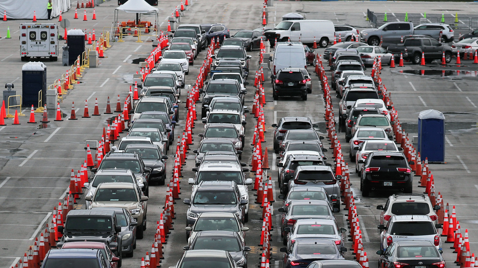 Lines and lines of cars are seen as drivers wait on Monday to be tested for COVID-19 at a coronavirus testing site in Miami Gardens, Fla. (Joe Raedle/Getty Images)