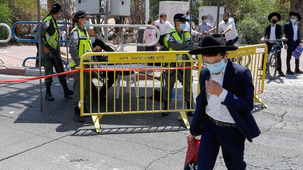 Israeli security forces control access to a neighborhood that has been isolated following an increase in coronavirus cases in the southern coastal city of Ashdod, on July 2.