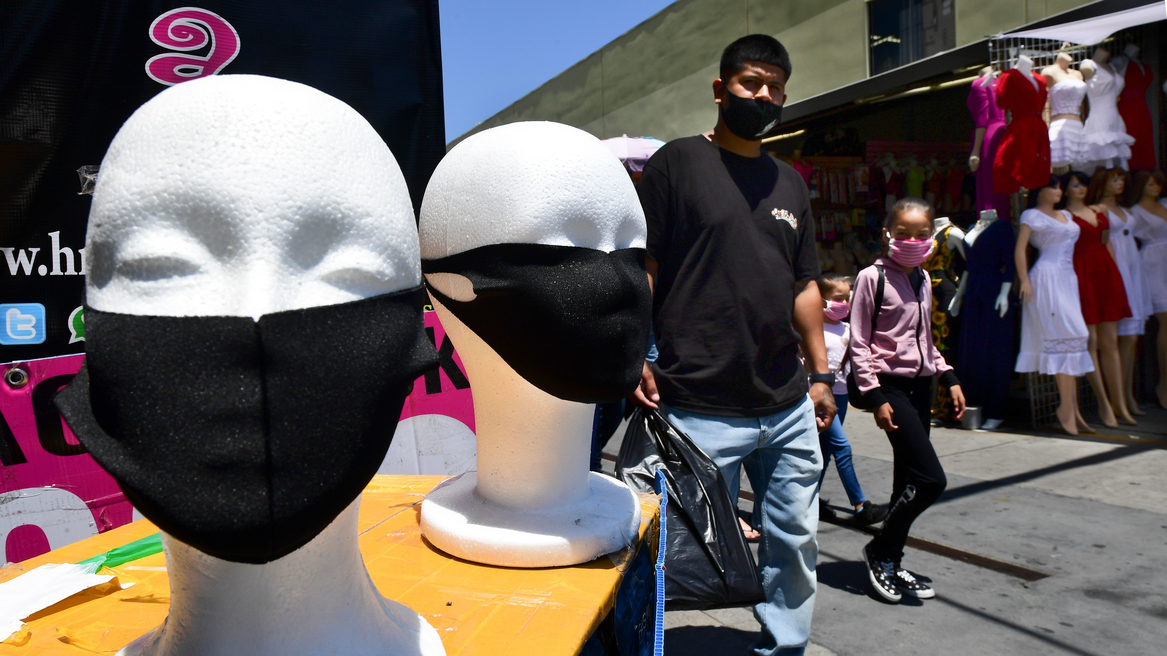Face coverings are seen on display in Los Angeles on July 2. California Gov. Gavin Newsom threatened this week to withhold up to $2.5 billion in aid to local police departments that refuse to enforce mask rules and other pandemic-related mandates. (AFP via Getty Images)