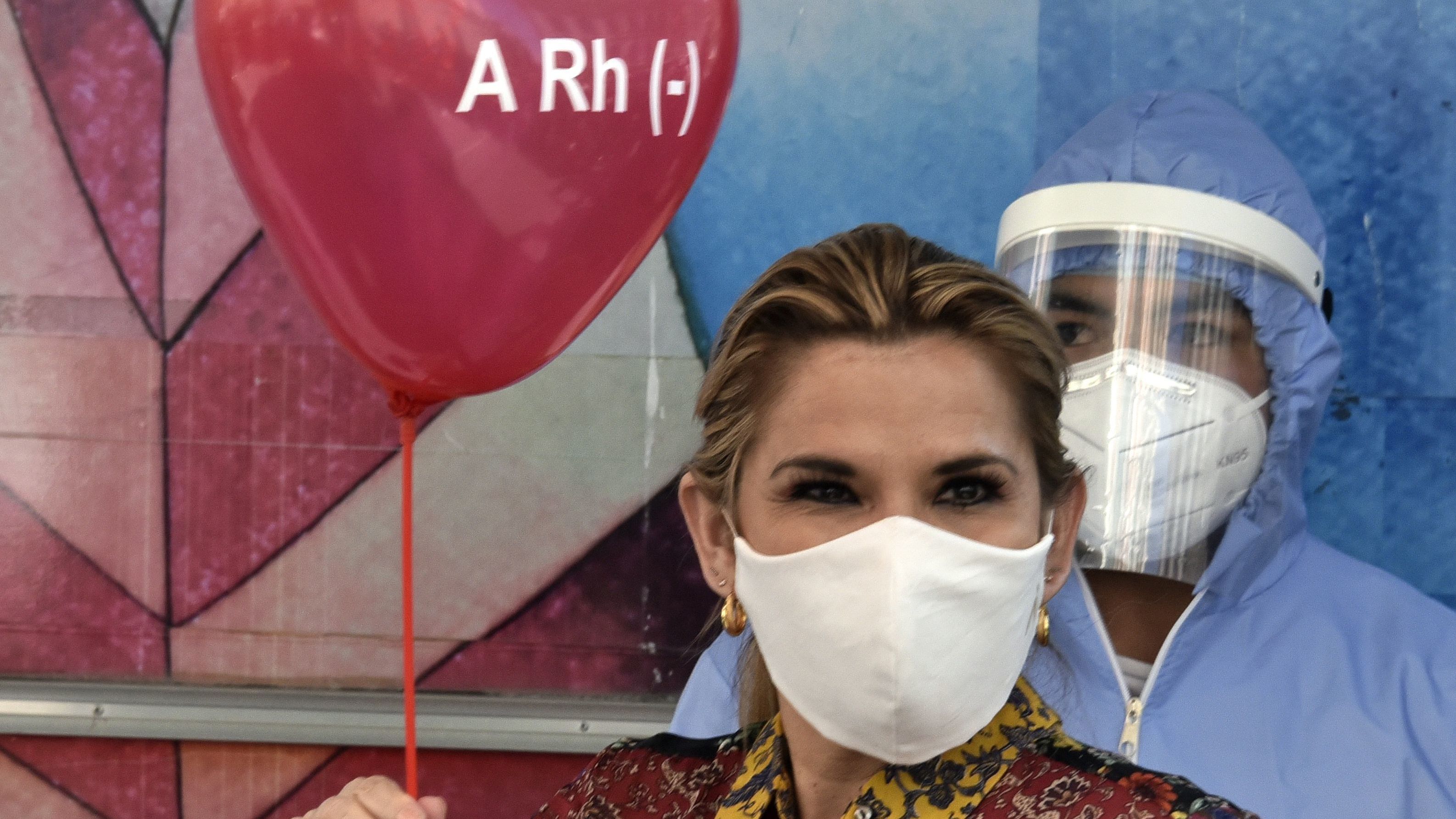 Bolivian President Jeanine Áñez is pictured before donating blood at the presidential palace in La Paz last month amid the COVID-19 pandemic.