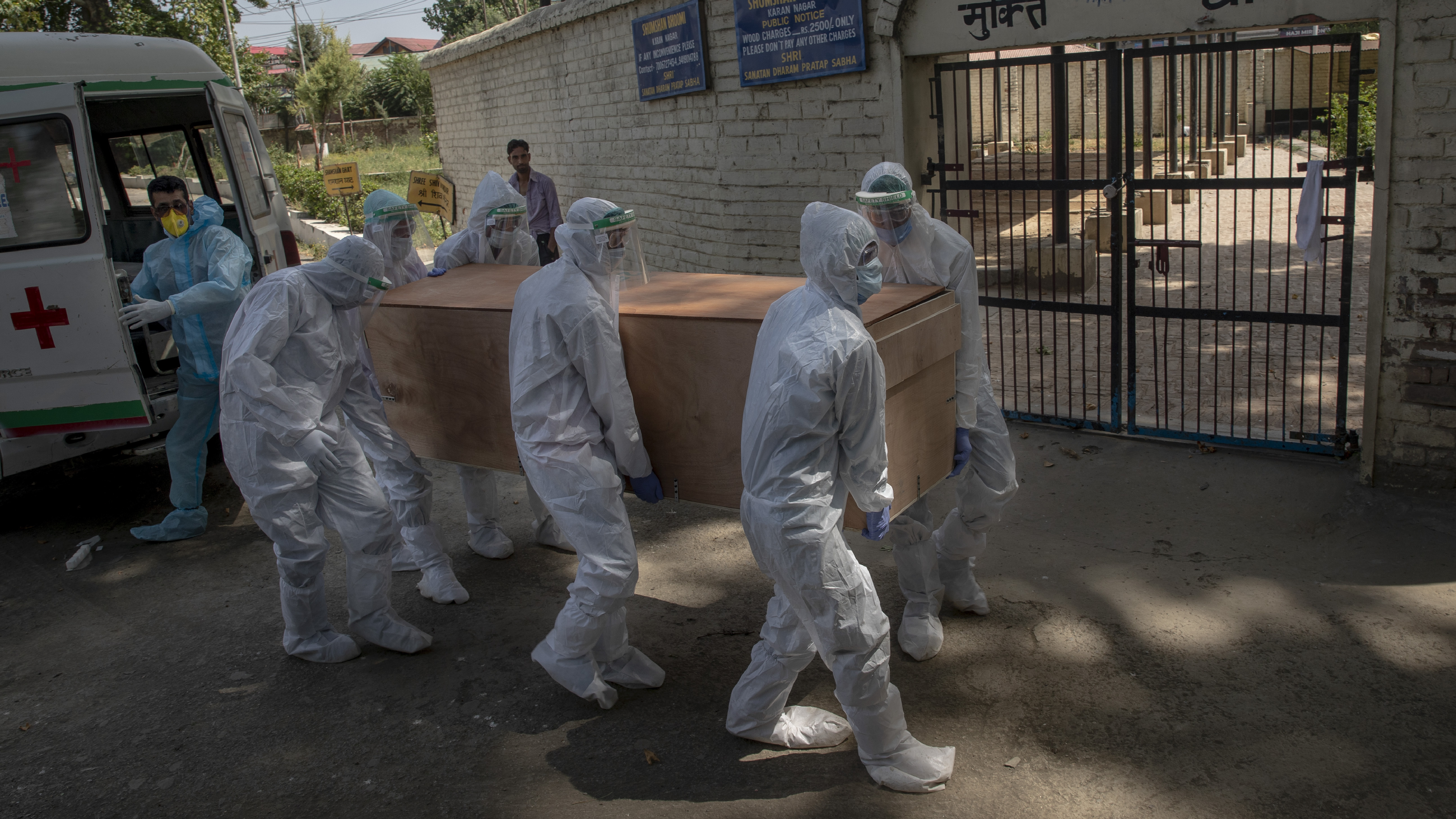 Indian paramilitary soldiers carry the body of a paramilitary officer who died of COVID-19 to a crematorium in Srinagar, Indian-controlled Kashmir, on Tuesday. India is the third-ranked nation in the number of reported infections.