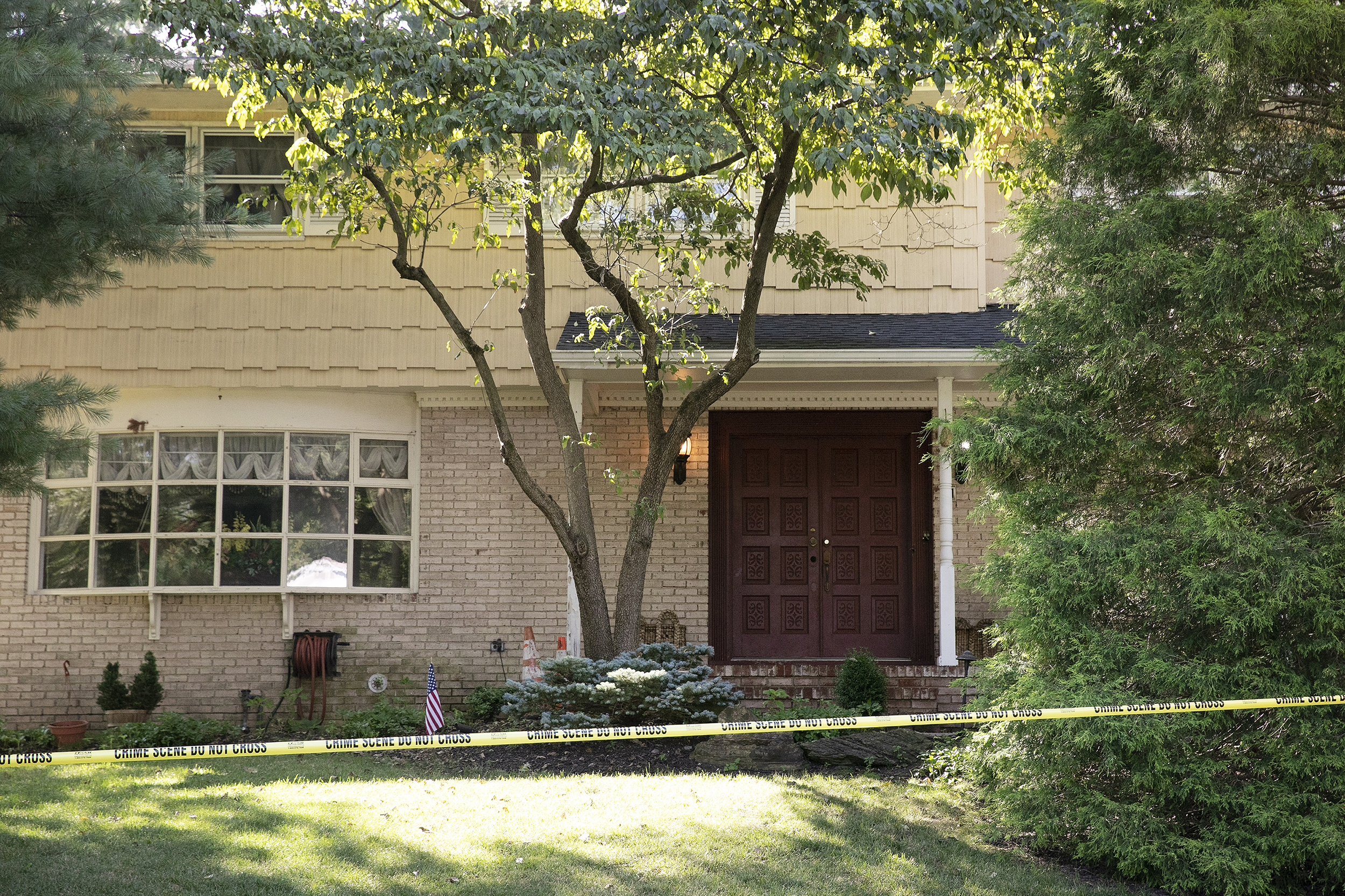 Crime scene tape surrounds the home of U.S. District Judge Esther Salas on Monday in North Brunswick, N.J. A gunman posing as a delivery person shot and killed Salas' 20-year-old son and wounded her husband on Sunday evening at their home before fleeing, according to officials.