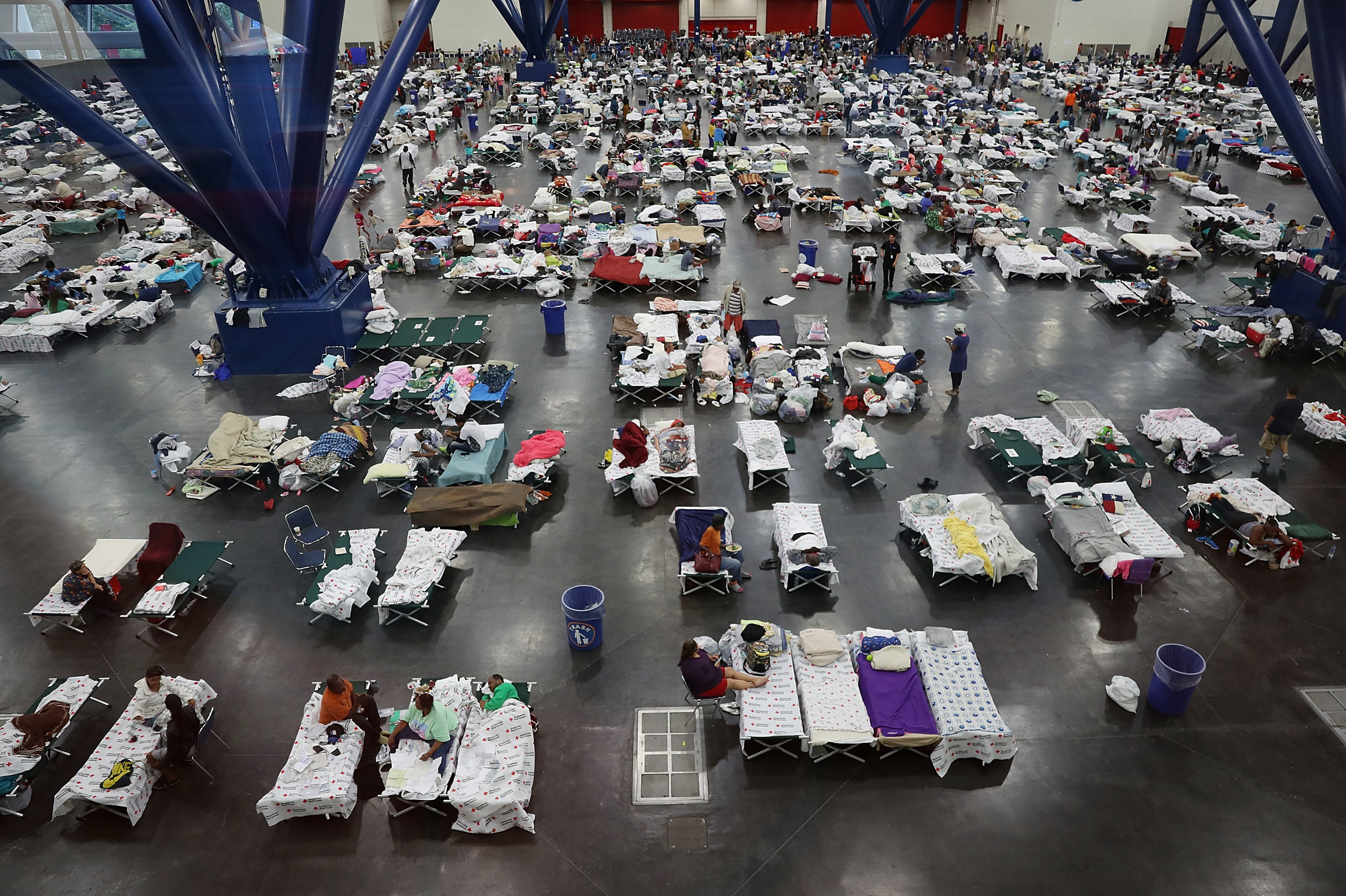 In August 2017, the George R. Brown Convention Center in Houston was over capacity after floodwaters from Hurricane Harvey inundated the city. This hurricane season, congregate shelters — from school gyms to vast convention centers — risk becoming infection hot spots if evacuees pack into them as they have in the past. (Getty Images)