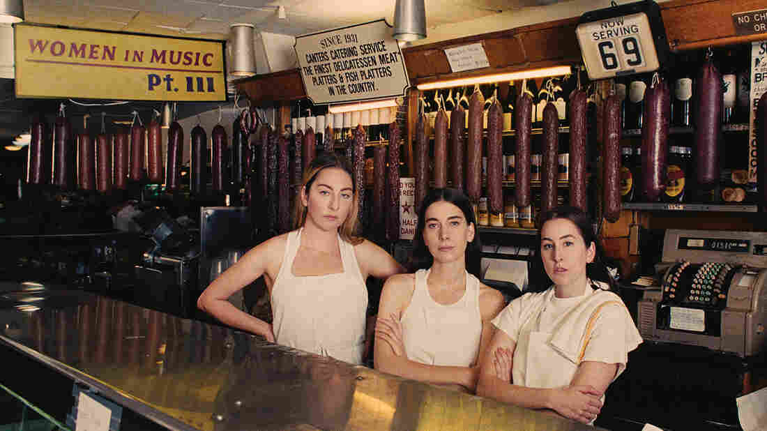 Sisters Este, Danielle, and Alana Haim of the band HAIM join Ask Me Another.