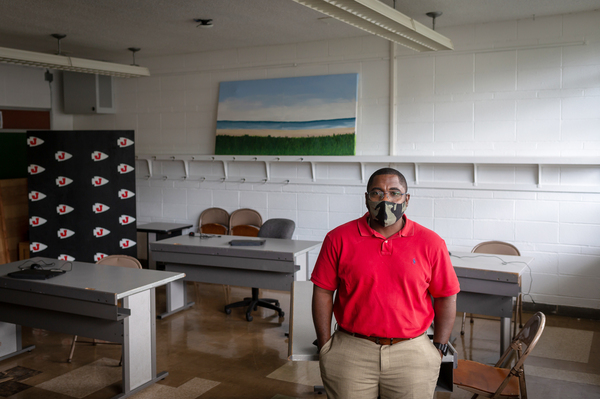 Business teacher Marc Reid spaced tables out in the classroom he's teaching in this summer. He said it can be hard to hear his students when they're spread out and talking through masks.