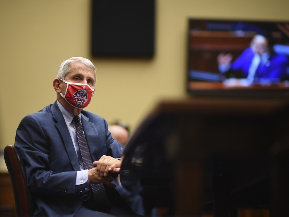Dr. Anthony Fauci, director of the National Institute of Allergy and Infectious Diseases, listens during a House subcommittee hearing on Friday. (Kevin Dietsch/AP)