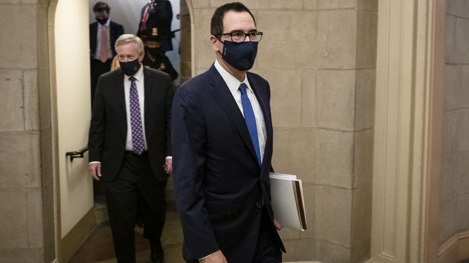 Treasury Secretary Steven Mnuchin (right) and White House chief of staff Mark Meadows leave the U.S. Capitol on Thursday after a meeting with House Speaker Nancy Pelosi and Senate Minority Leader Chuck Schumer.