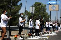 Mourners hold 23 crosses Monday in front of a Walmart honoring those killed in the 2019 attack in El Paso, Texas.