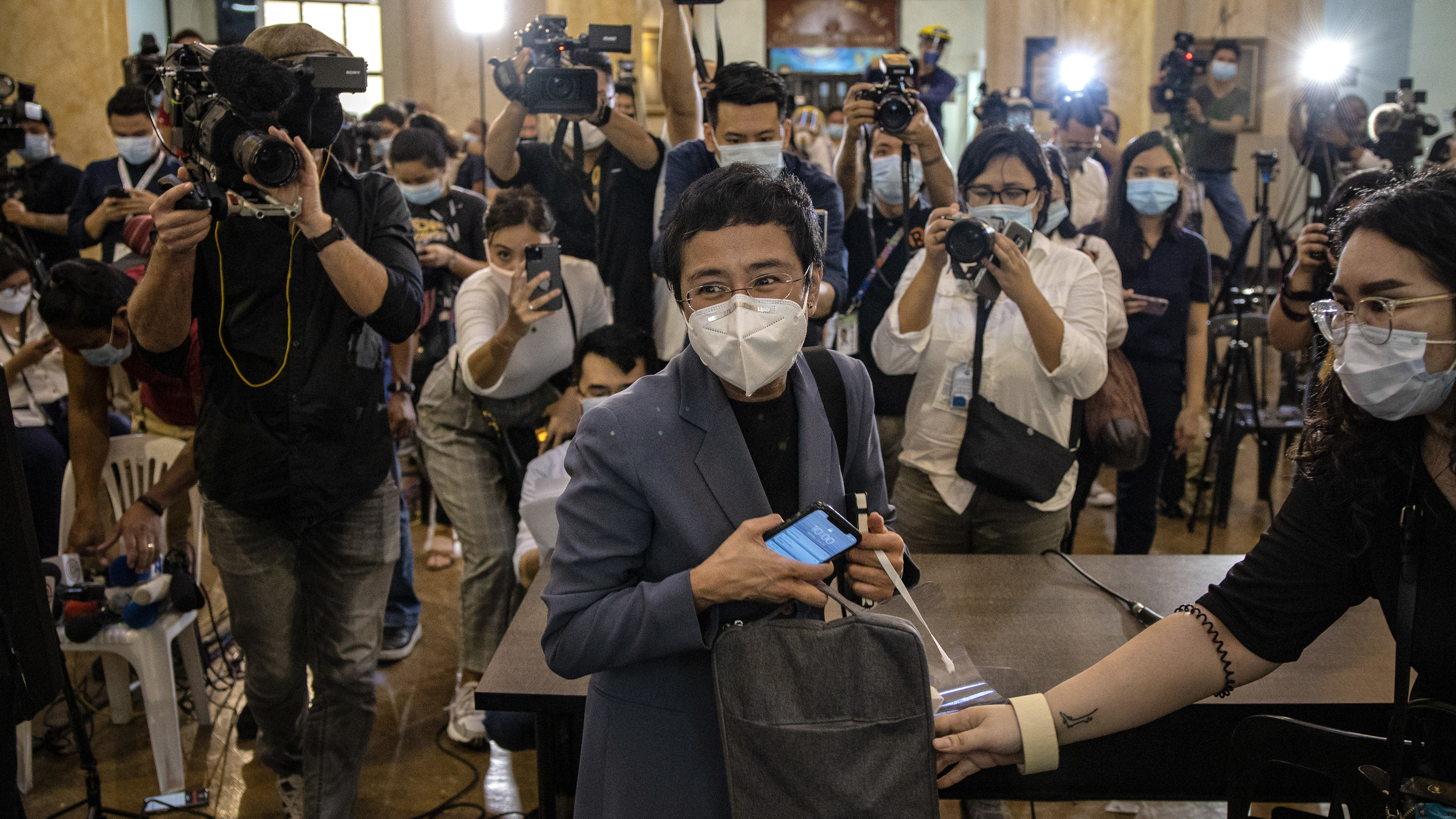 Maria Ressa, CEO of the Rappler news site, leaves a Philippine regional trial court after being convicted for cyber libel on June 15. Ressa, a veteran journalist and outspoken critic of President Rodrigo Duterte, is the focus of A Thousand Cuts, a documentary to be released virtually in the U.S. on Aug. 7.