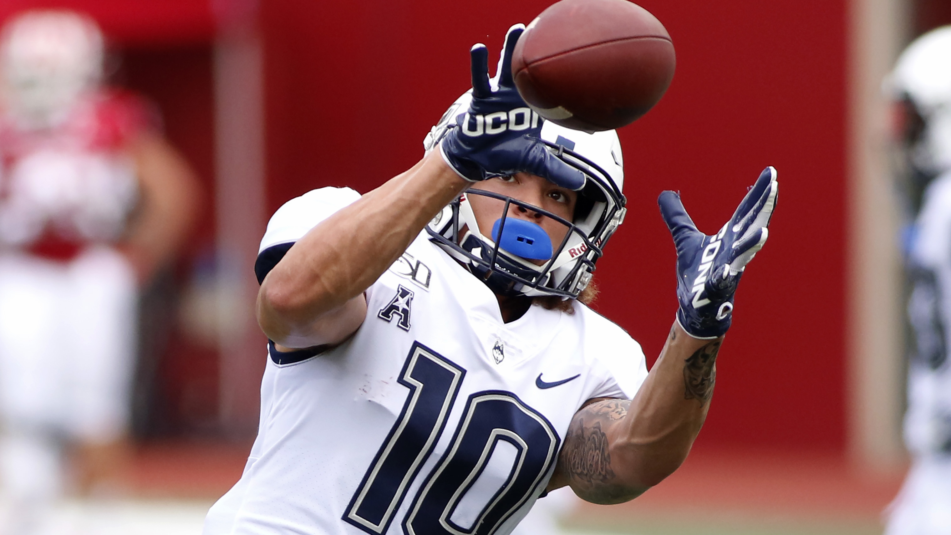 Wide receiver Zavier Scott of the UConn Huskies warms up before a game on Sept. 21, 2019, in Bloomington, Ind. Citing "safety challenges," UConn Director of Athletics David Benedict said the school decided to cancel its 2020-21 football season.