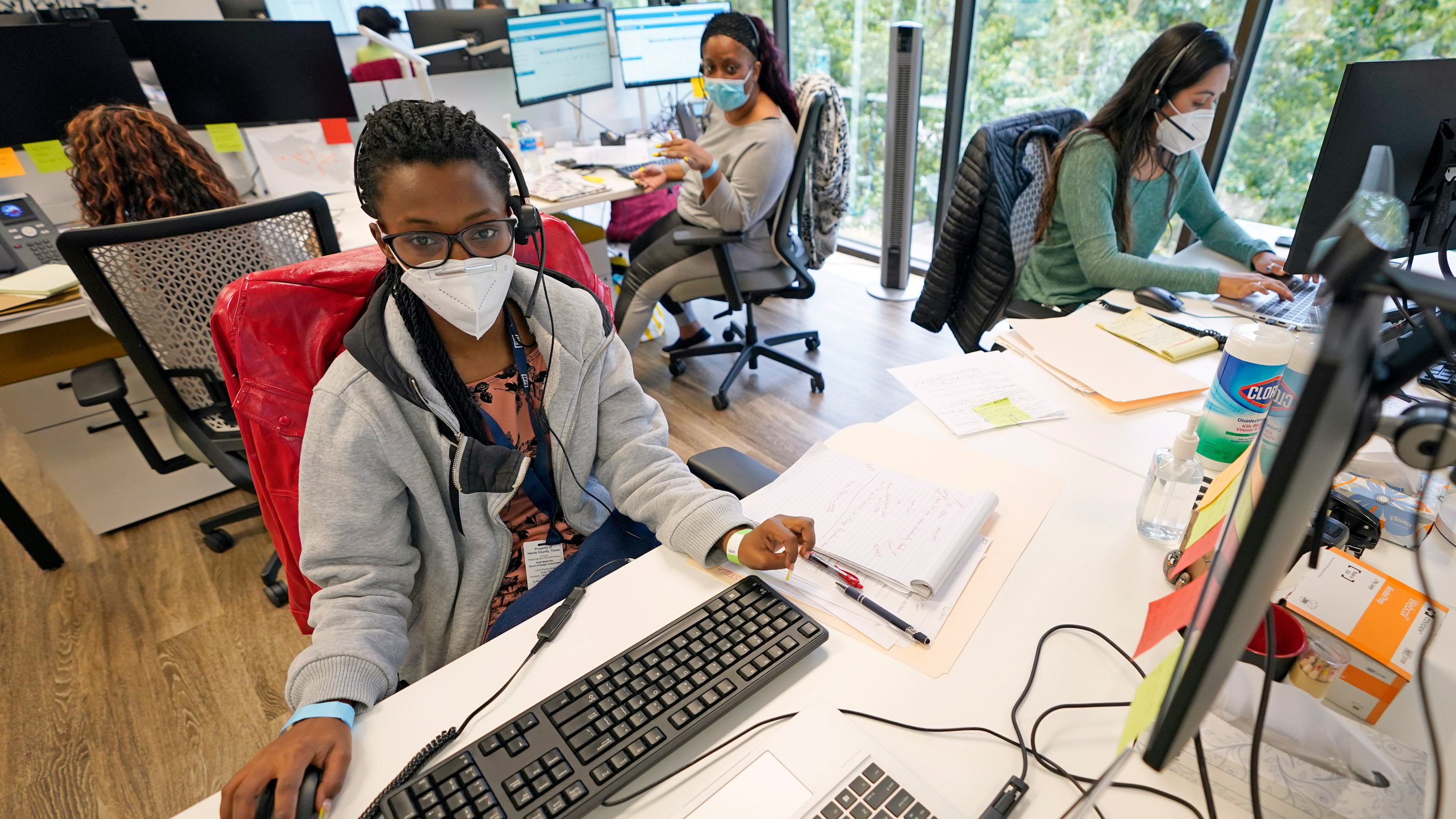 From left to right; contact tracers Christella Uwera, Dishell Freeman and Alejandra Camarillo work at Harris County Public Health Contact Tracing facility in Houston, Texas, Thursday, June 25, 2020.