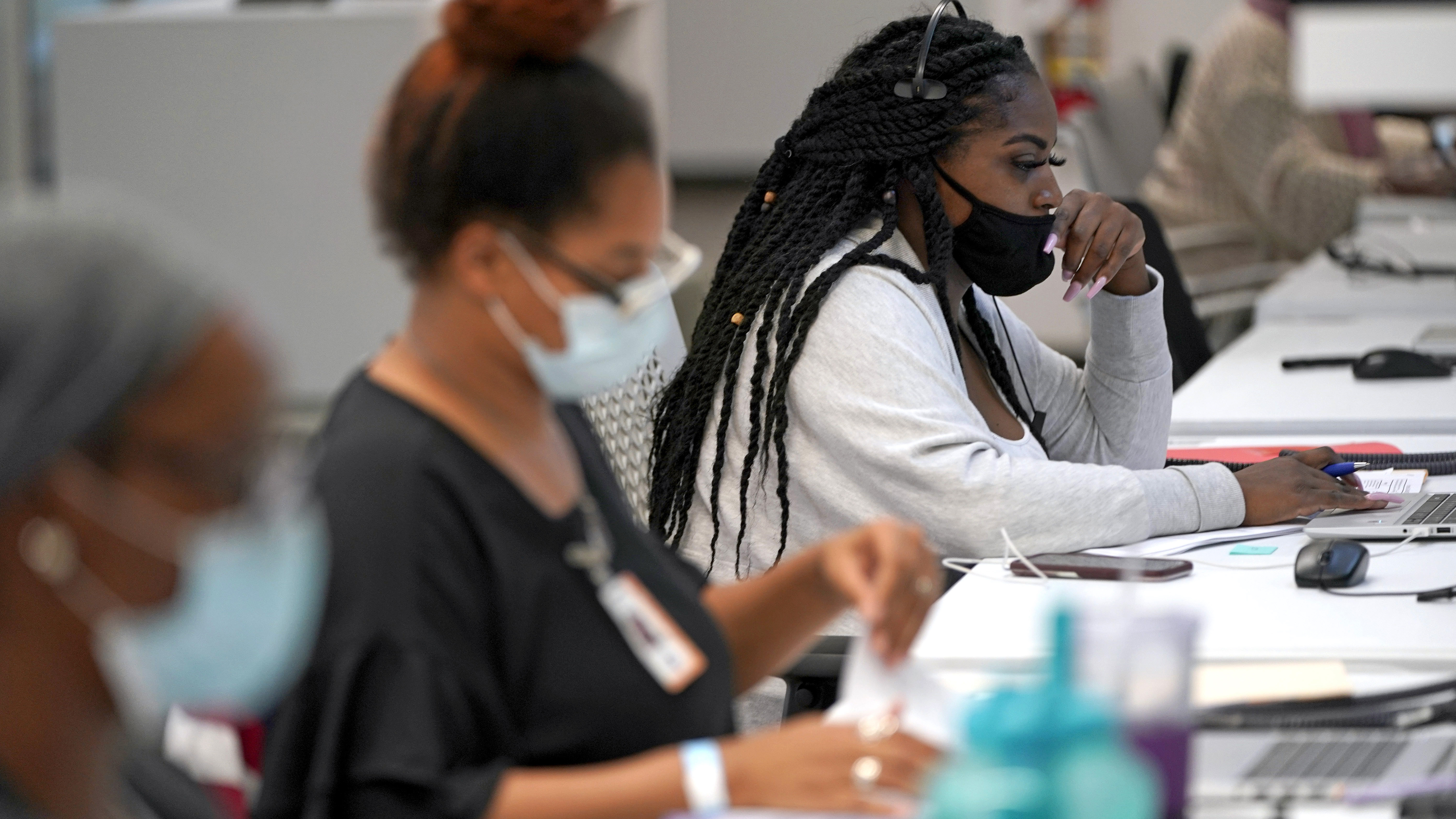 Contact tracer Kandice Childress, right, works at Harris County Public Health contact tracing facility, on June 25.