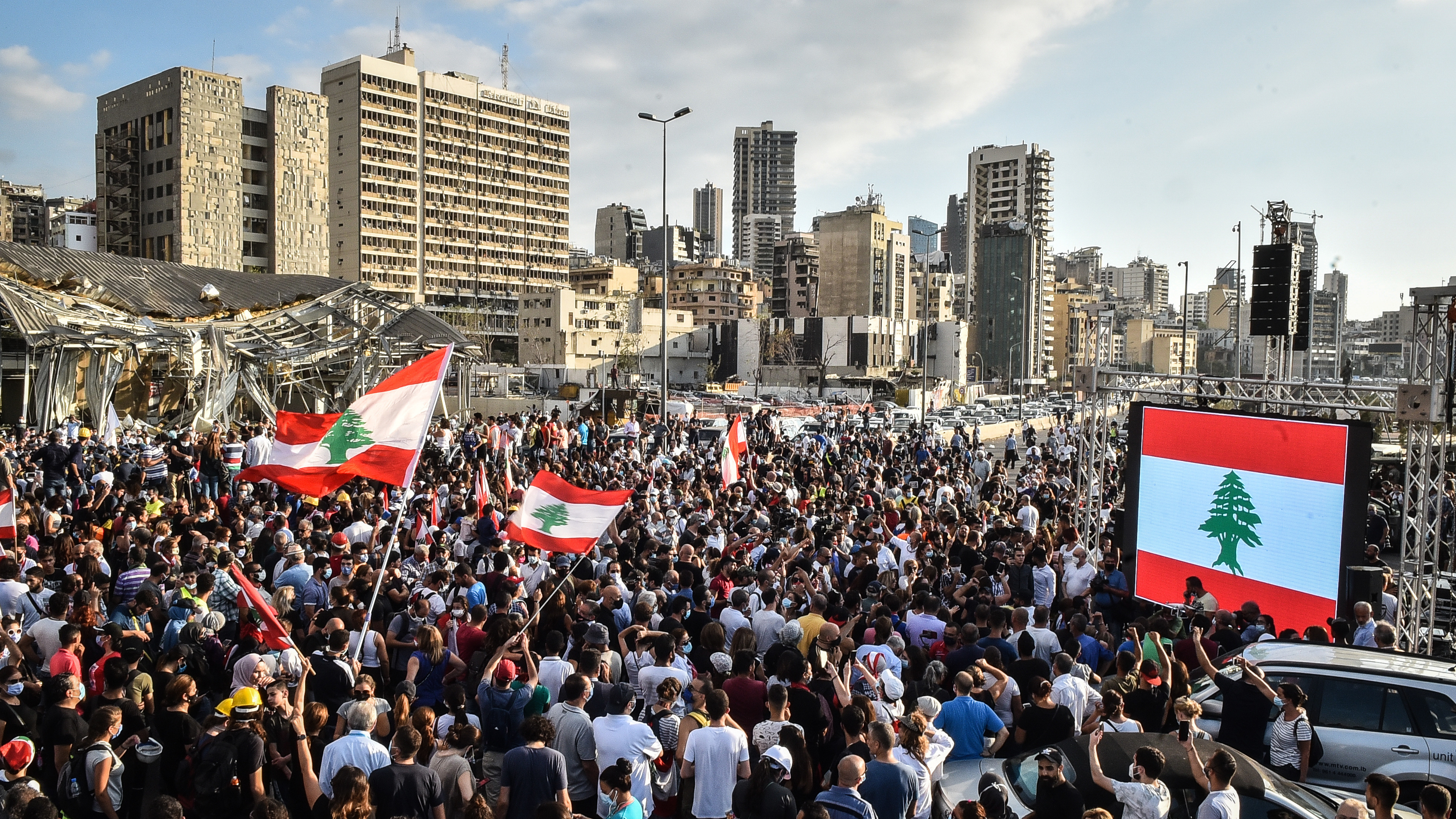 People wave Lebanese flags at a protest near the Beirut port on Tuesday. Last week