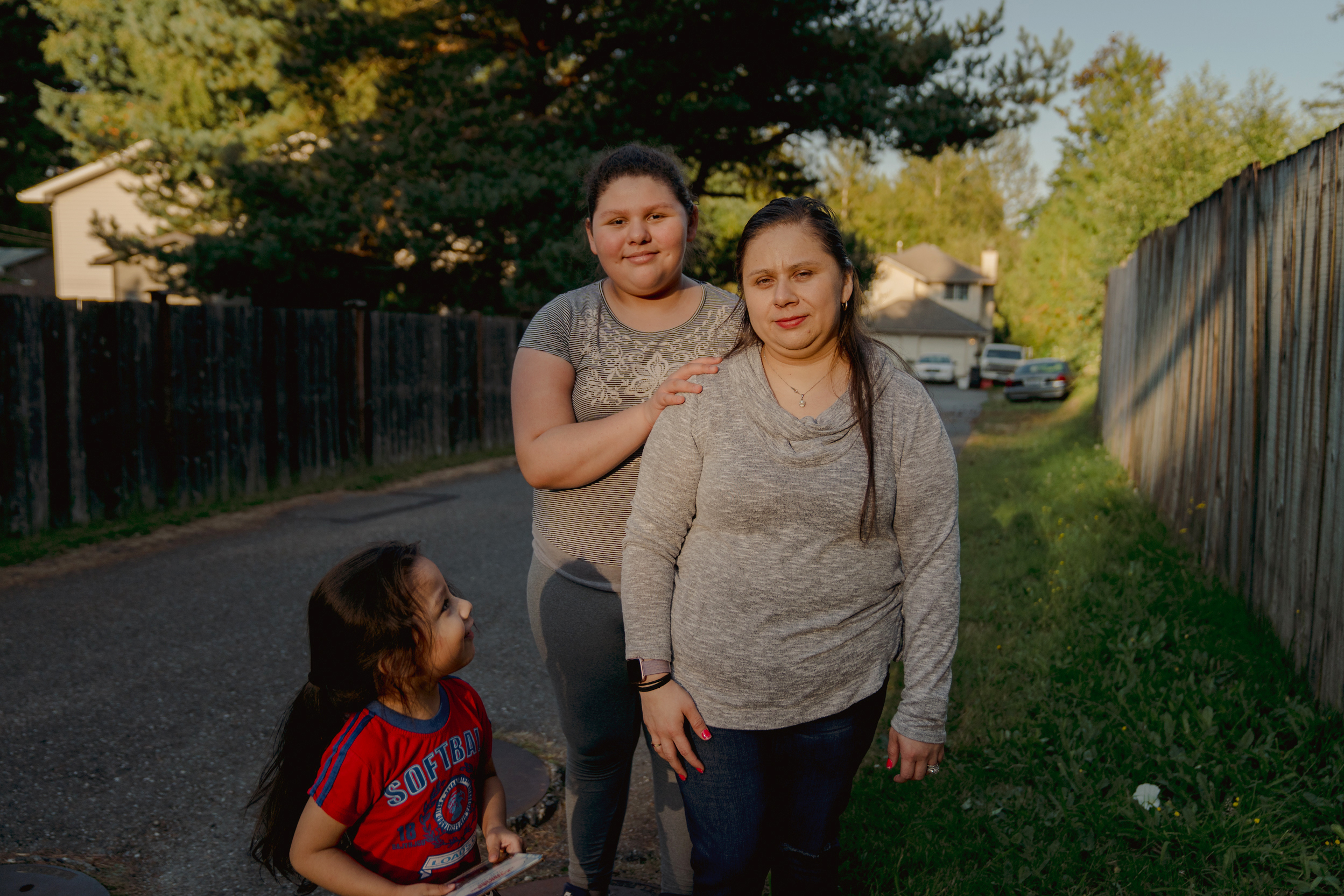 Patricia Lopez, right, with her daughter, Yamely Alfaro Lopez, 11, and son, Kevin Alfaro Lopez, 3, in Everett, Wash. (Jovelle Tamayo for NPR)