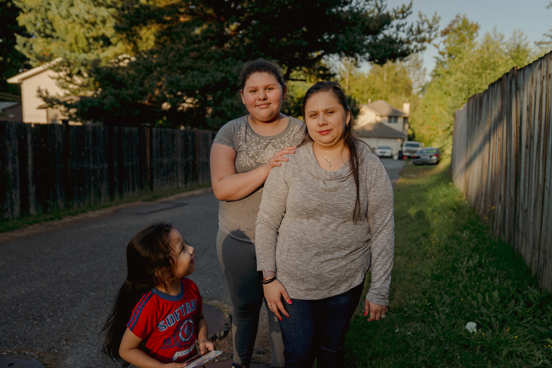 Patricia Lopez, right, with her daughter, Yamely Alfaro Lopez, 11, and son, Kevin Alfaro Lopez, 3, in Everett, Wash. (Jovelle Tamayo for NPR)