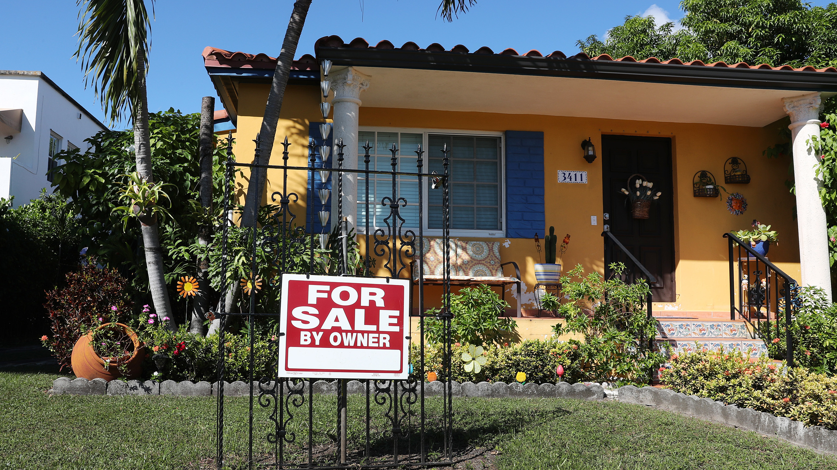 A sale sign is seen in front of a home in Miami. FHA loans are used by many minority, lower-income, and first-time homebuyers because the low down payments make homeownership more affordable. But this demographic is more likely to be hurt financially during the pandemic, and many FHA borrowers are skipping mortgage payments. (Getty Images)
