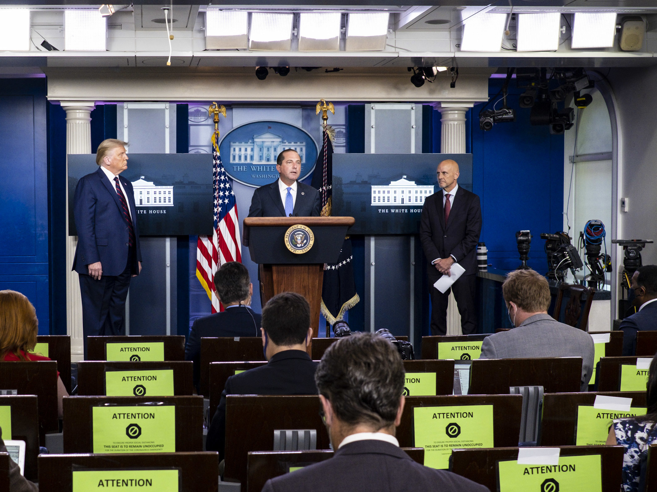 President Donald Trump, left, FDA Commissioner Stephen Hahn, right, and Health and Human Services Secretary Alex Azar, center, announced at a news conference on Sunday that the FDA issued emergency use authorization for convalescent plasma as a COVID-19 treatment. (Getty Images)