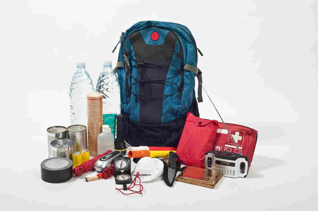 A bag including supplies like a battery and canned food just in case people evacuate during a hurricane.
