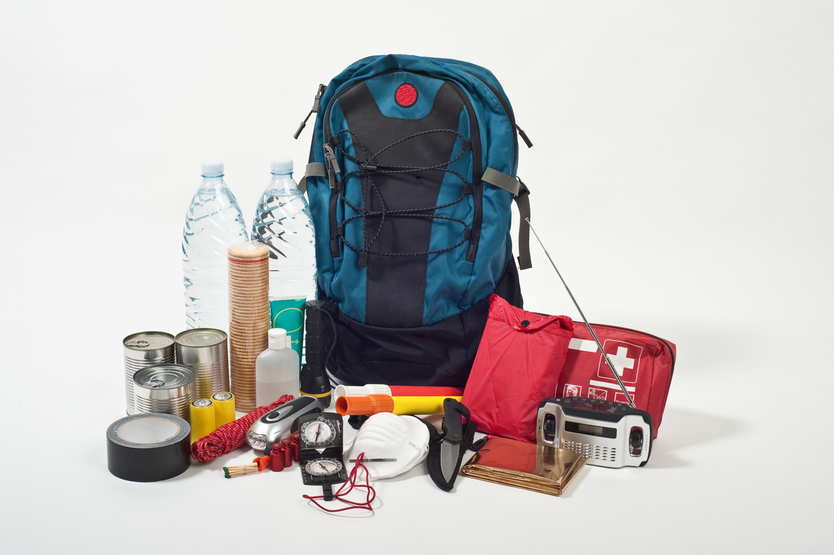 A bag including supplies like a battery and canned food just in case people evacuate during a hurricane.