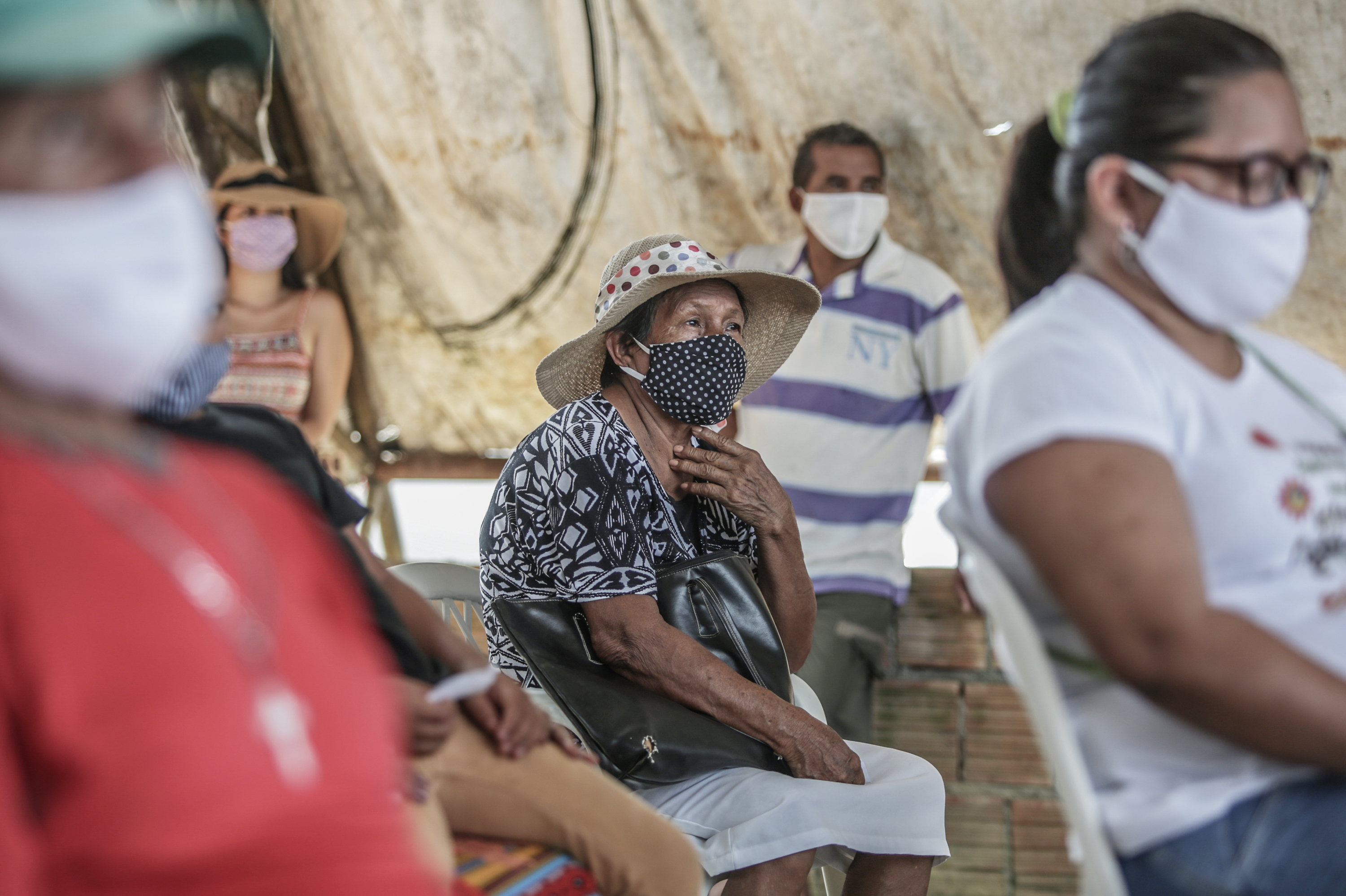 People wait for a flu vaccine in May in Manaus, Brazil. The flu season had a surprisingly low count of influenza cases in the Southern Hemisphere, and researchers are trying to figure out the role coronavirus precautions might have played. (Getty Images)