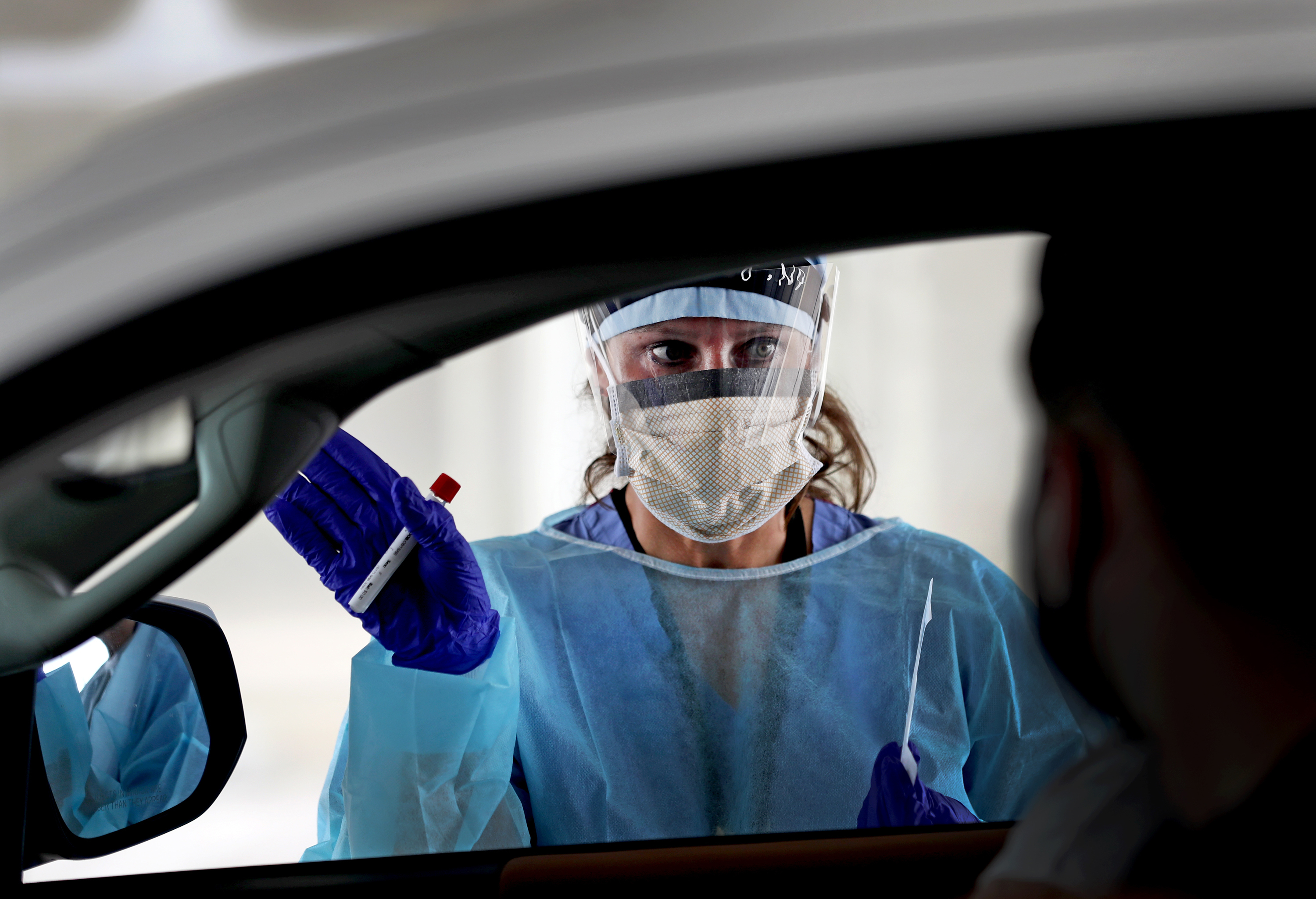Testing contacts of those with confirmed cases of the coronavirus is a common public health practice. New CDC guidelines make it optional. (The Boston Globe via Getty Images)