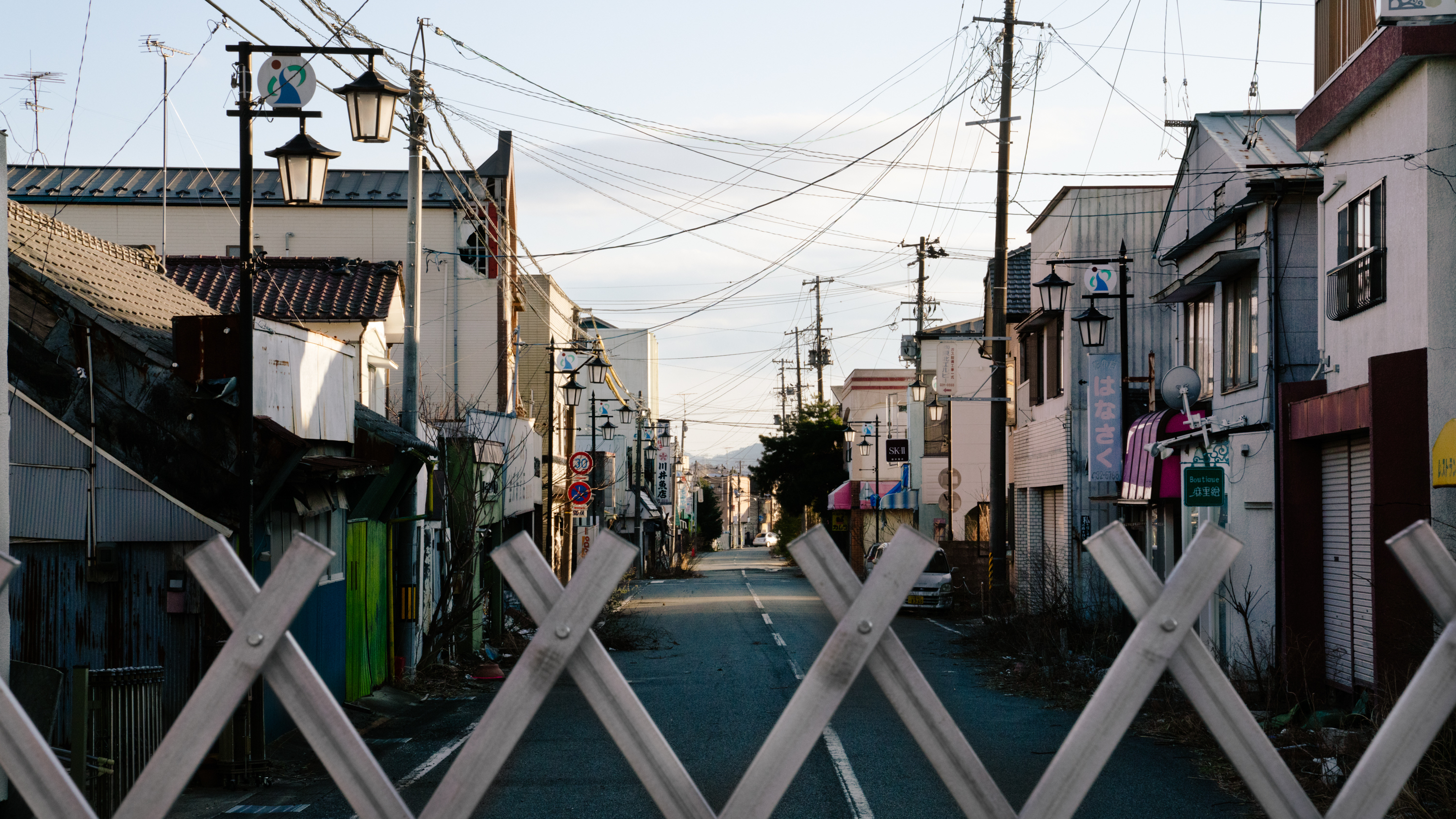 A view over a gate blocking off the old downtown of Okuma, in Fukushima Prefecture. Fukushima was forever changed by one of the world
