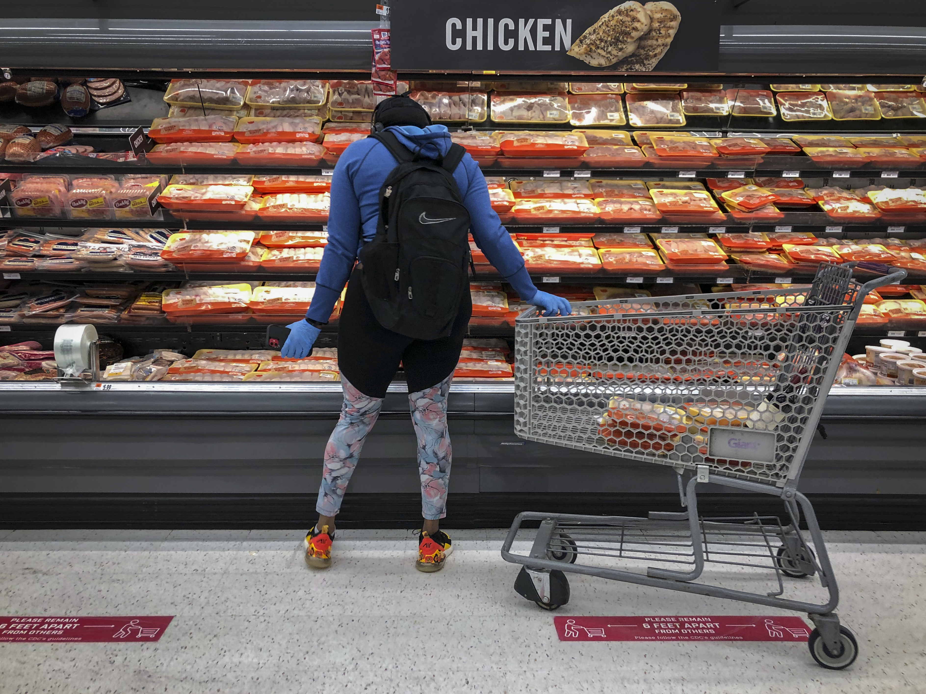 The Federal Reserve knows that &quot;higher prices for essential items such as food, gasoline and shelter add to the burdens faced by many families,&quot; Fed Chairman Jerome Powell said. But he noted that ultra-low inflation or deflation is also a threat. (Getty Images)