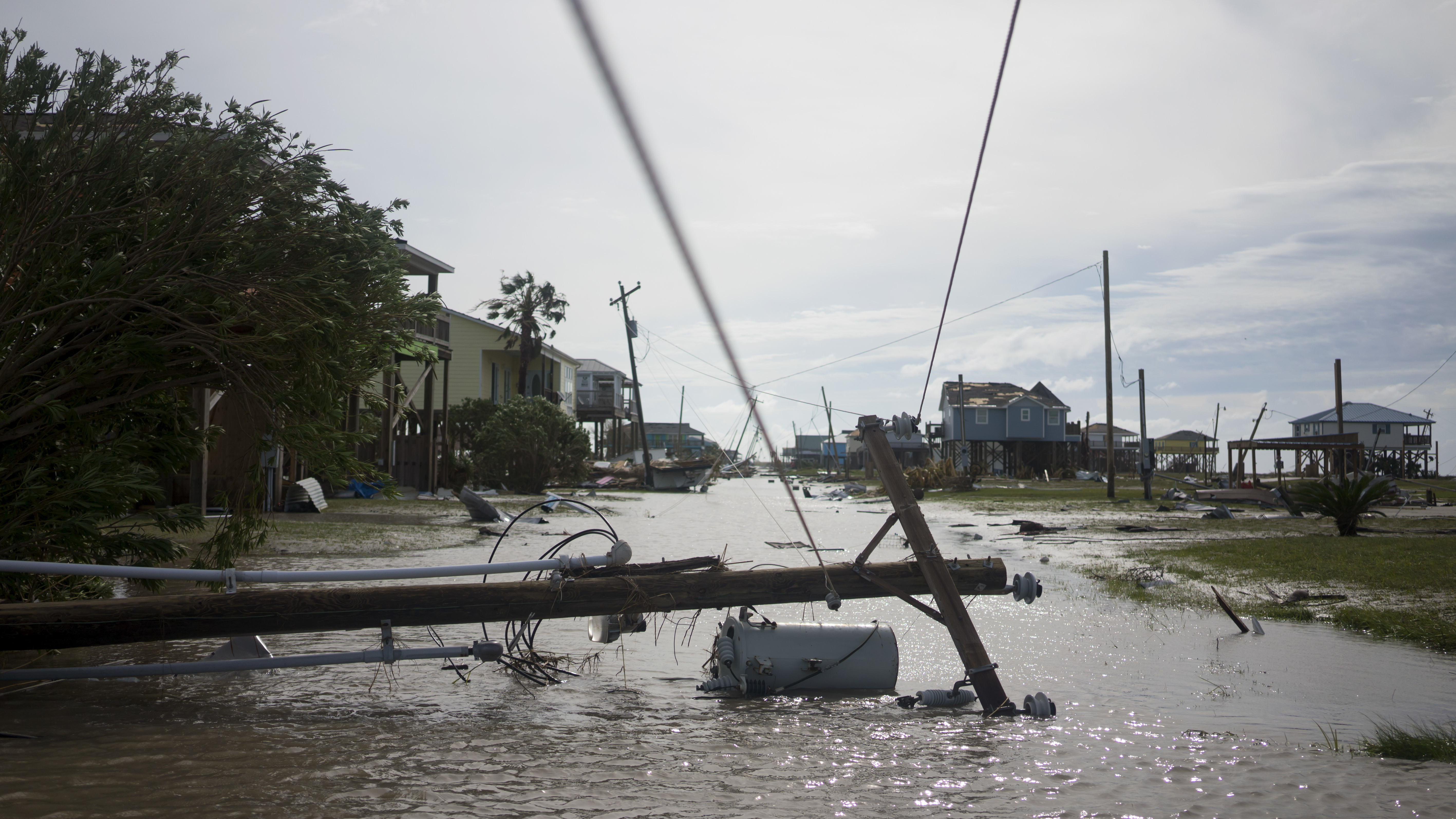 Damaged homes sit among floodwaters after Hurricane Laura passed through the area Thursday in Holly Beach, La.