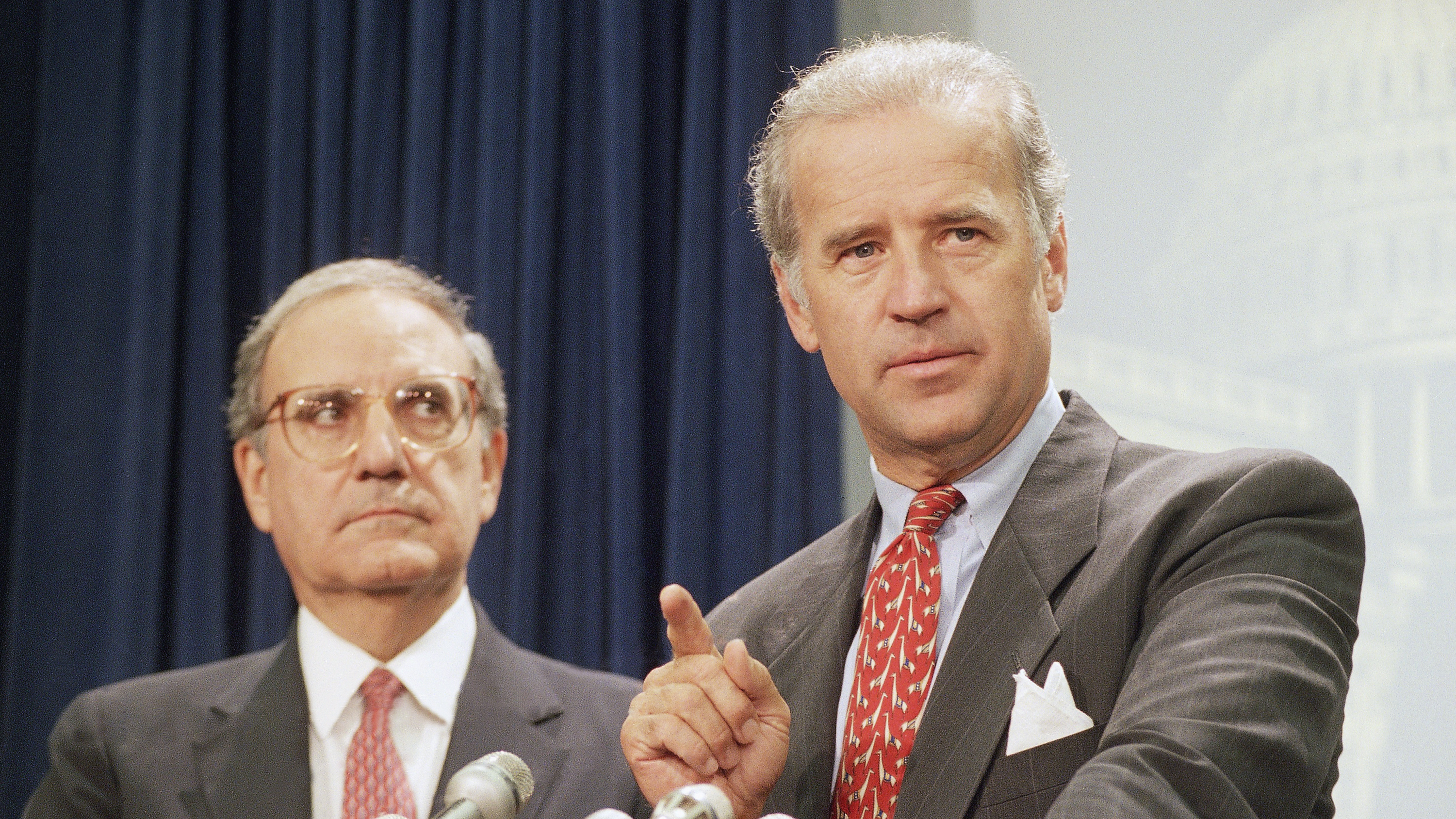 Then-Sen. Joe Biden, right, at Capitol Hill news conference in 1994 after the Senate voted on a major crime bill.