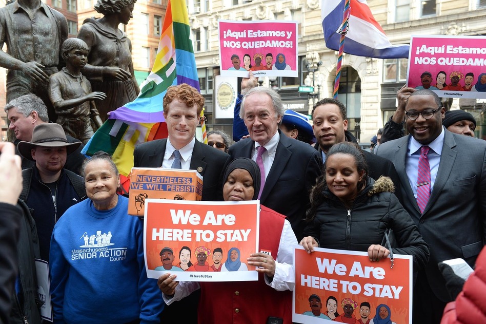 U.S. Rep. Joe Kennedy III (D-Mass.), center left, and Sen. Edward Markey (D-Mass.), center right (R) during a 2017 protest against Trump administration immigration policies. The two lawmakers face each other in a Democratic primary this Tuesday. (Darren McCollester/Getty Images)