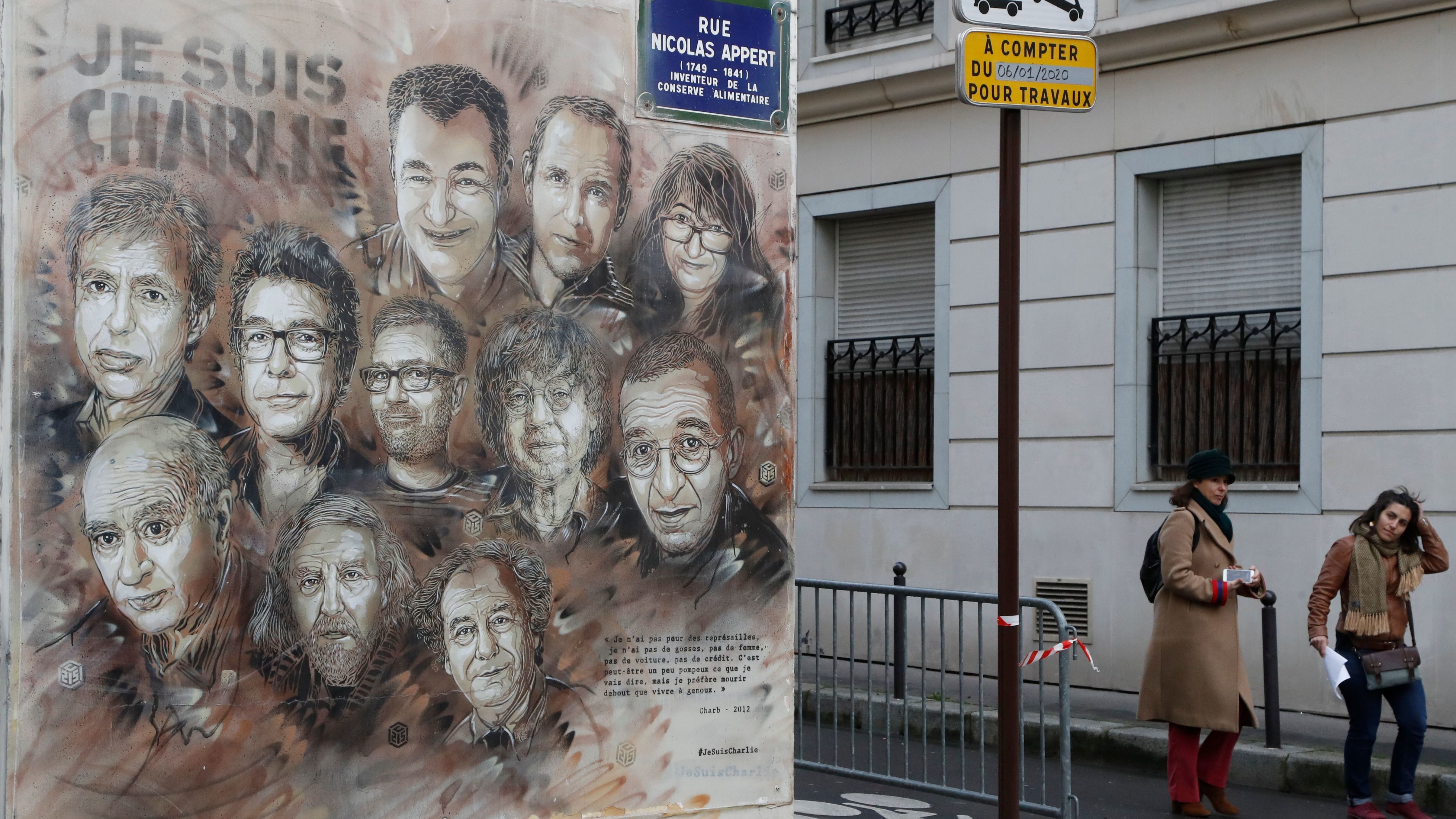The work of French street artist Christian Guemy aka "C215" depicting members of satirical magazine Charlie Hebdo is painted on a facade near the magazine