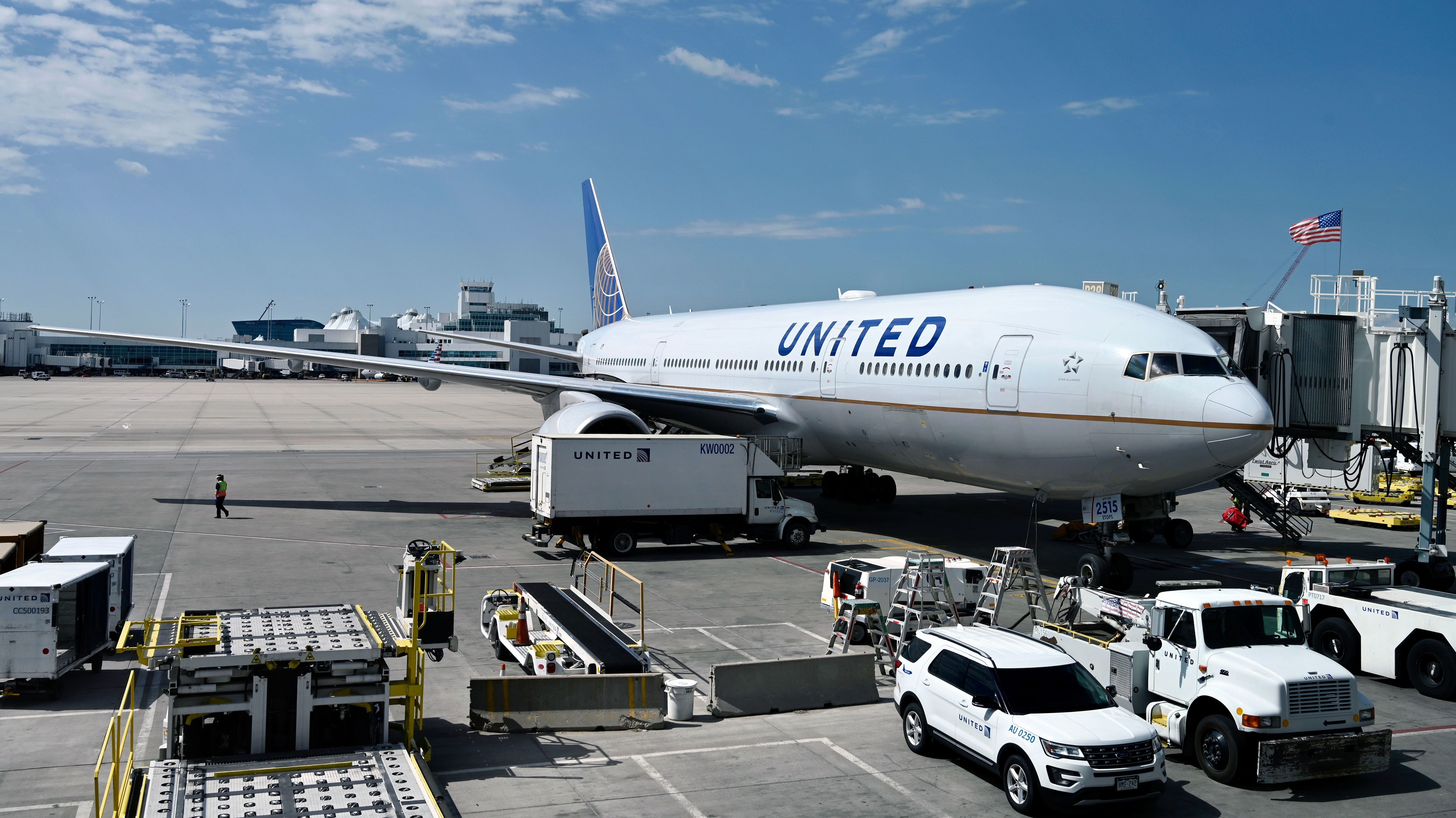 A United Airlines plane sits at the gate at Denver International Airport on July 30. The airline industry has been hit hard by the coronavirus pandemic. (AFP via Getty Images)