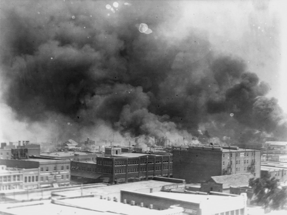 In 1921, smoke billows over Tulsa, Okla., the scene of one of the nation's most brutal race massacres. (Library of Congress Via AP)