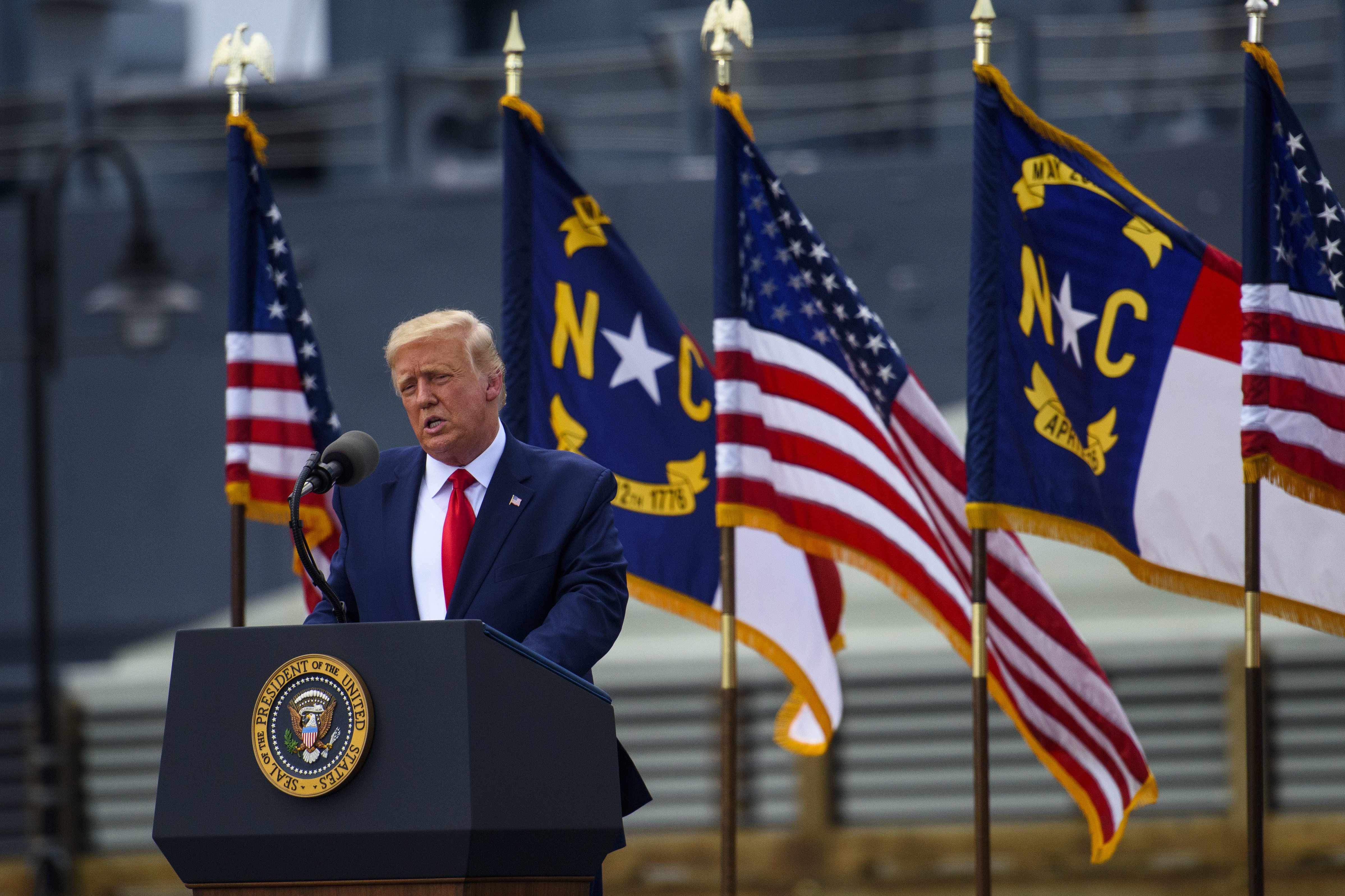 President Trump visited Wilmington, N.C., on Wednesday and urged supporters to try to vote in person after sending in a mail-in ballot — actions that would be both illegal and disruptive. (Getty Images)