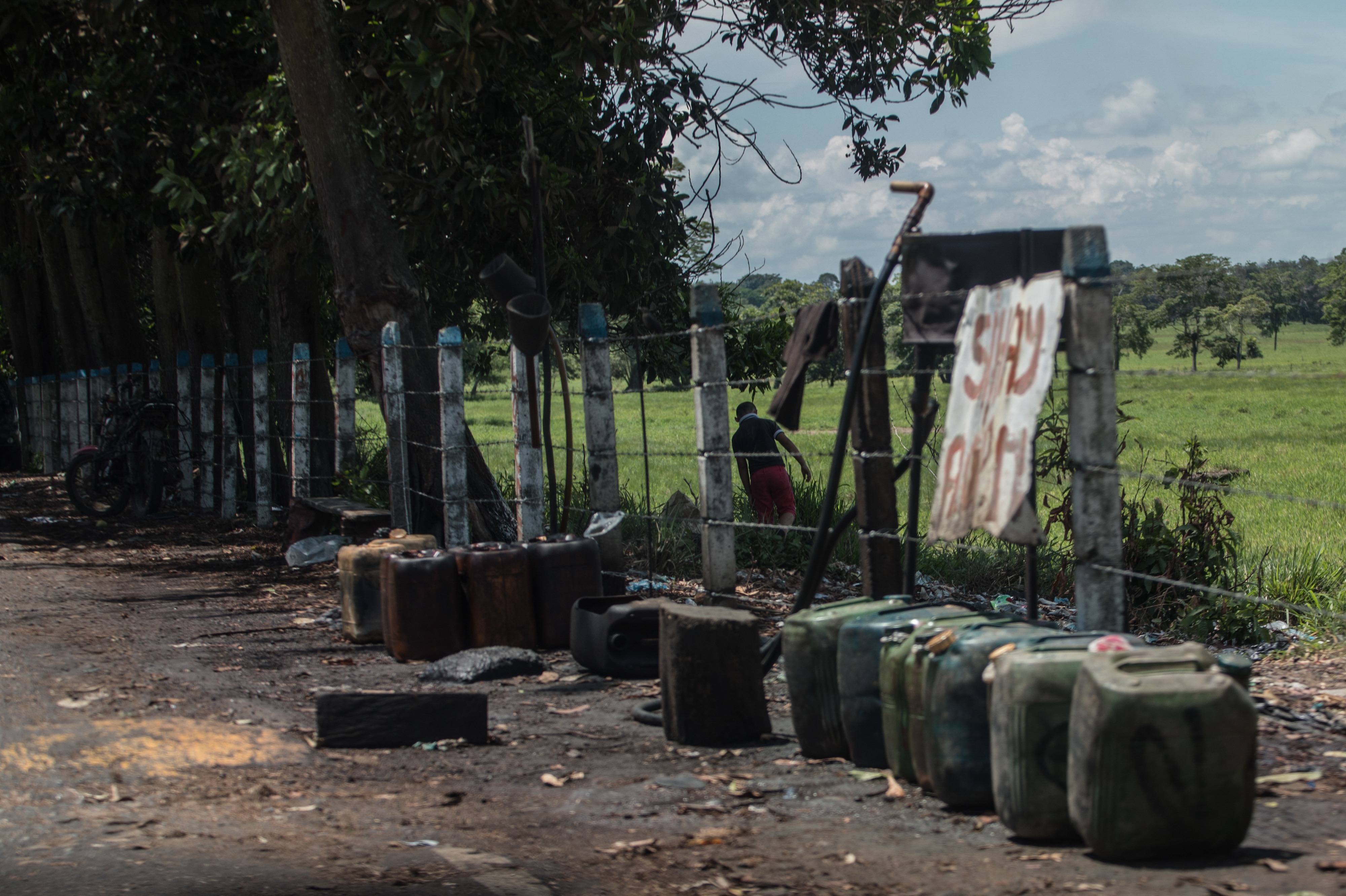 Contraband fuel sits on the side of a road in Puerto Santander, Colombia, on May 31, 2019. The Venezuelan government's lack of cash to import gasoline combined with U.S. sanctions targeting the oil sector have led to chronic fuel shortages in Venezuela. That has upended a long-running, lucrative contraband gas trade. (Bloomberg via Getty Images)