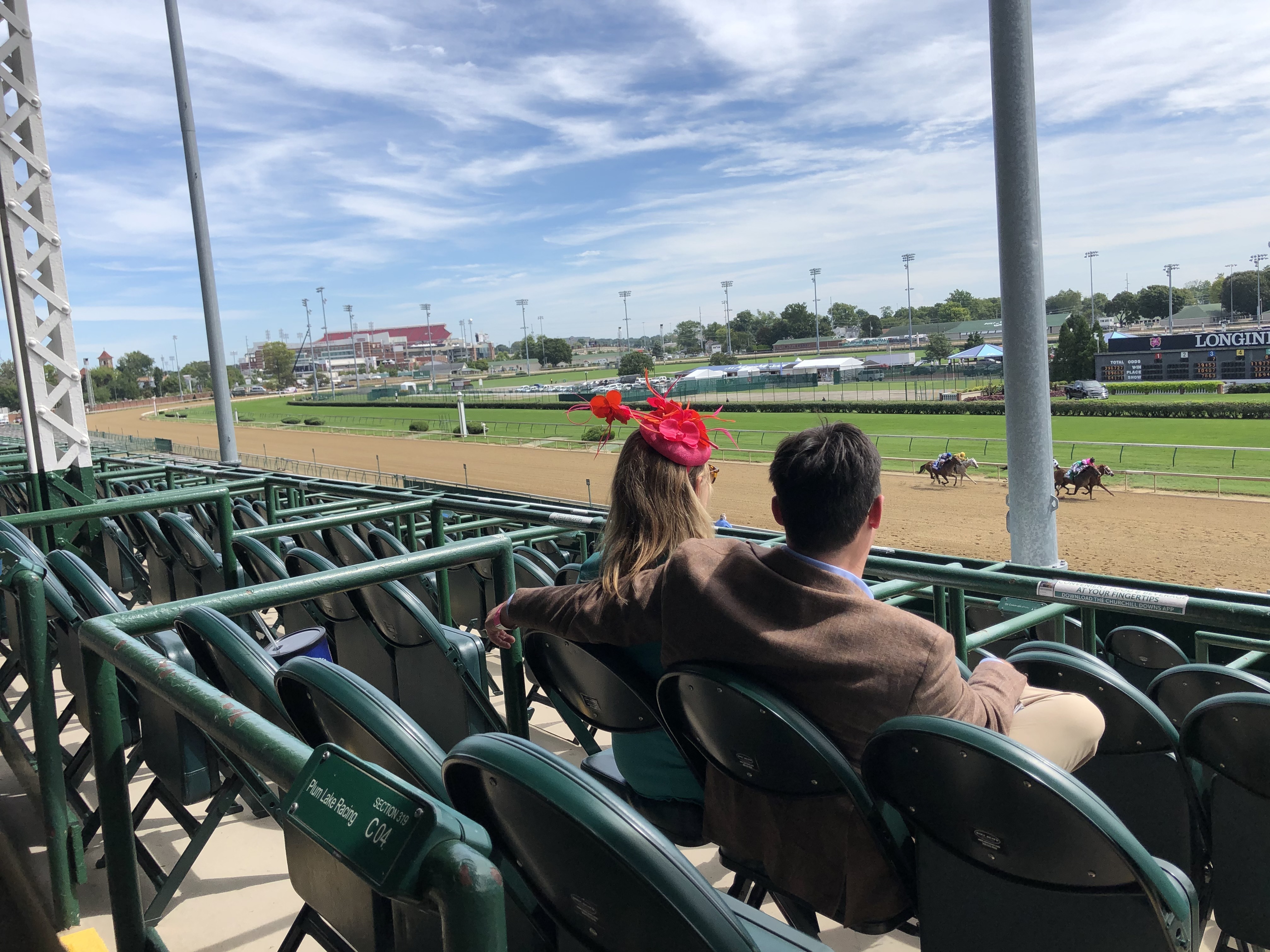 Spectators in an otherwise empty grandstand watch the Kentucky Oaks at Churchill Downs on Sept. 4. Oaks is typically a daylong party, a kick-off to the Kentucky Derby, which runs the following day. (WFPL)
