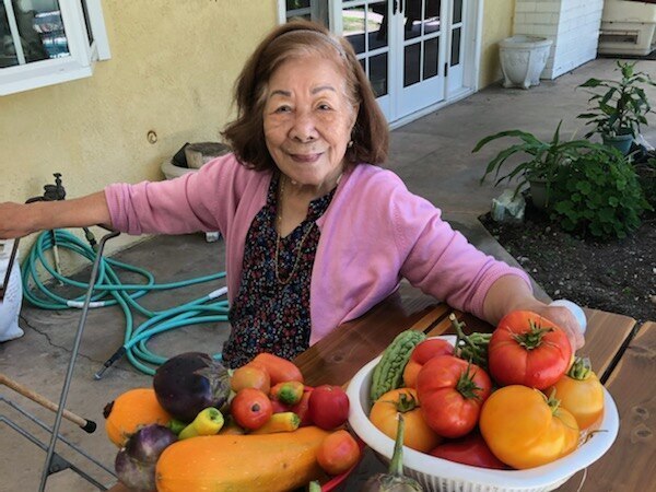 The author's grandmother, Felisa Mercene, 92, with the summer harvest from her son's garden in La Mirada, Calif.