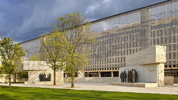 The Dwight D. Eisenhower Memorial in Washington, D.C., will be dedicated on Sept. 17. A stainless steel, woven "tapestry" made by artist Tomas Osinski stands behind the statues, and depicts the cliffs at Normandy.