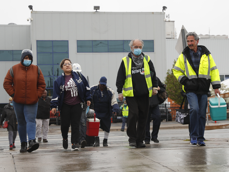 United Auto Workers members leave the Fiat Chrysler Automobiles Warren Truck Assembly plant after a shift in May in Warren, Mich. Car sales are picking up again, but automakers face a problem: getting enough workers. (Paul Sancya/AP)