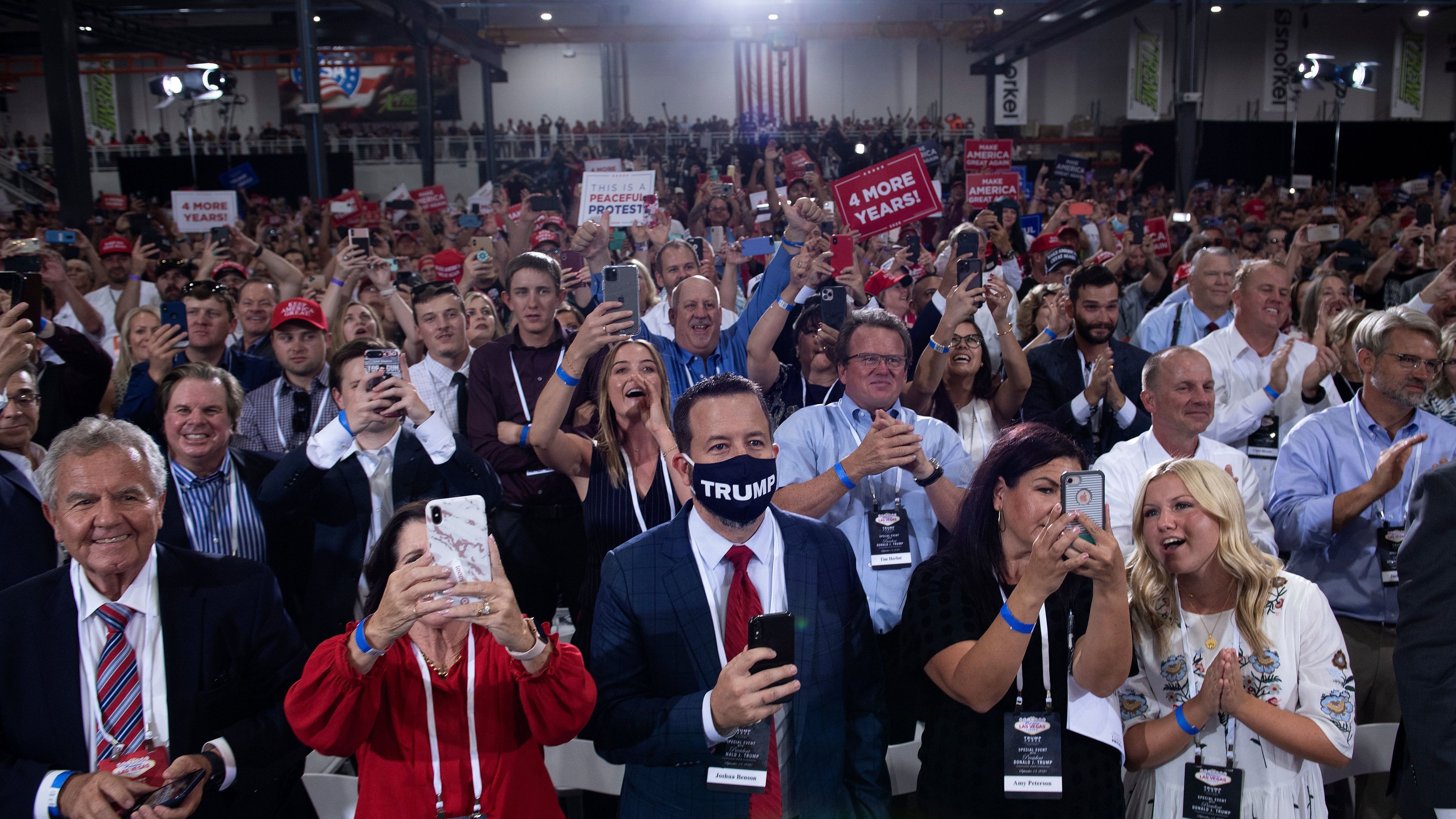 People cheer as President Trump arrives for an indoor campaign rally Sunday night at Xtreme Manufacturing in Henderson, Nev. (AFP via Getty Images)