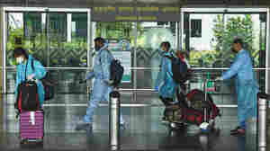 Coronavirus FAQ: I See People Wearing Disposable Coveralls On Planes. Good Idea?