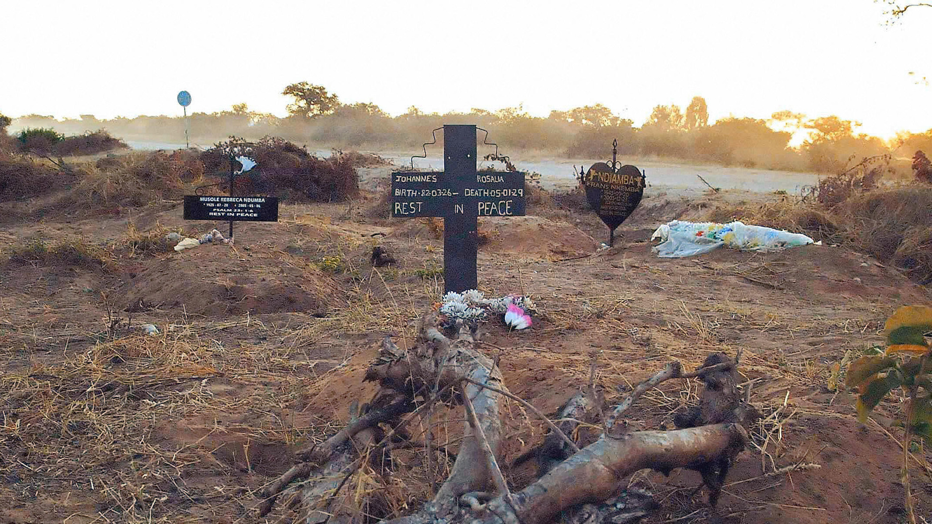 An illegal roadside graveyard in northeastern Namibia. People in the townships surrounding Rundu, a town on the border to Angola, are too poor to afford a funeral plot at the municipal graveyard — and resorted to burying their dead next to a dusty gravel road just outside of the town.