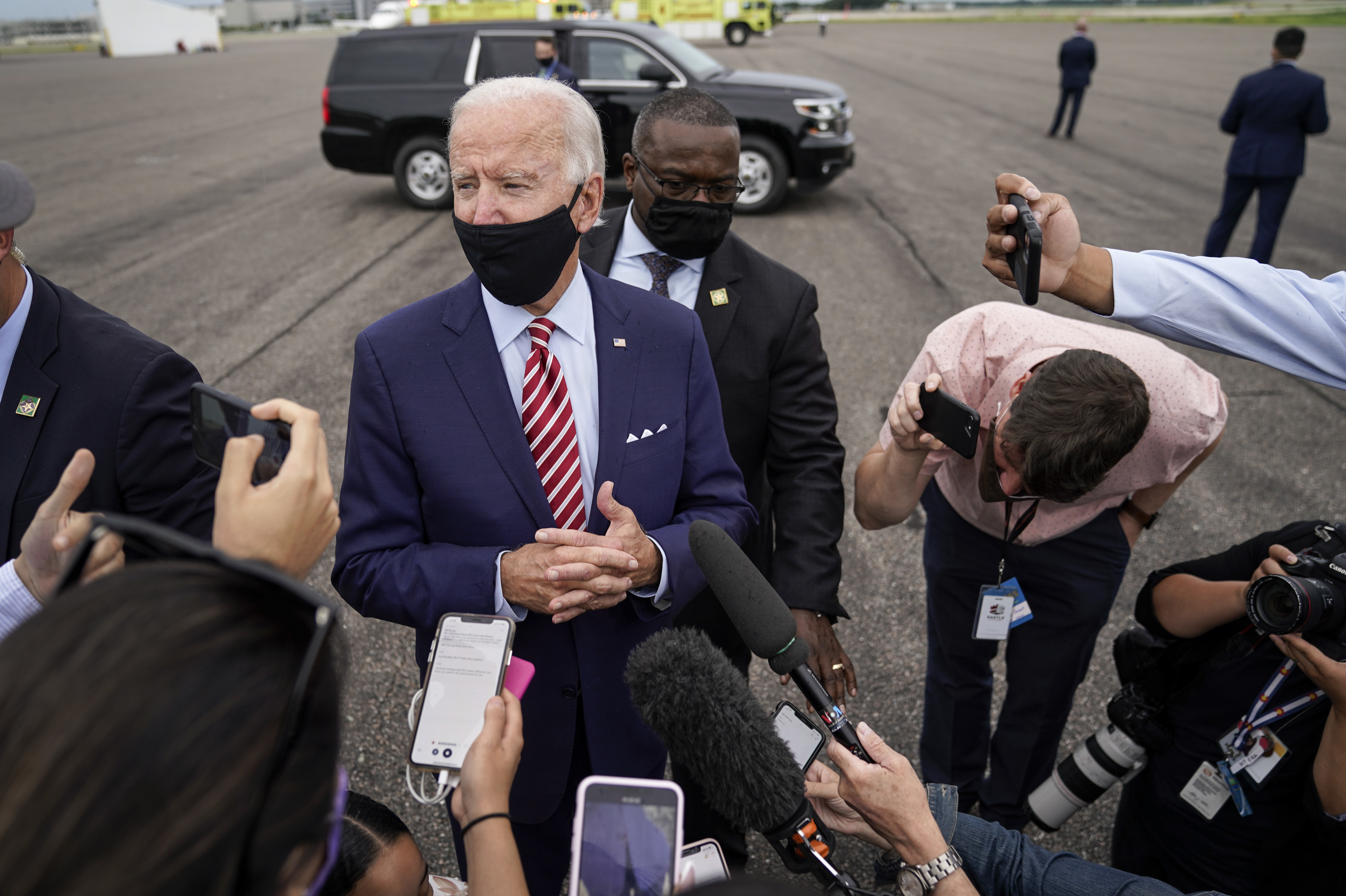 Democratic presidential nominee Joe Biden speaks to reporters before boarding his plane in Florida on Tuesday. Biden leads by 9 points against President Trump, who continues to face an uphill reelection battle. (Getty Images)