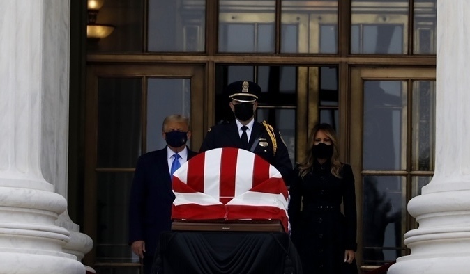 President Trump and first lady Melania Trump pay their respects to the late Justice Ruth Bader Ginsburg as she lies in repose at the Supreme Court. (Cheryl Diaz Meyer for NPR)