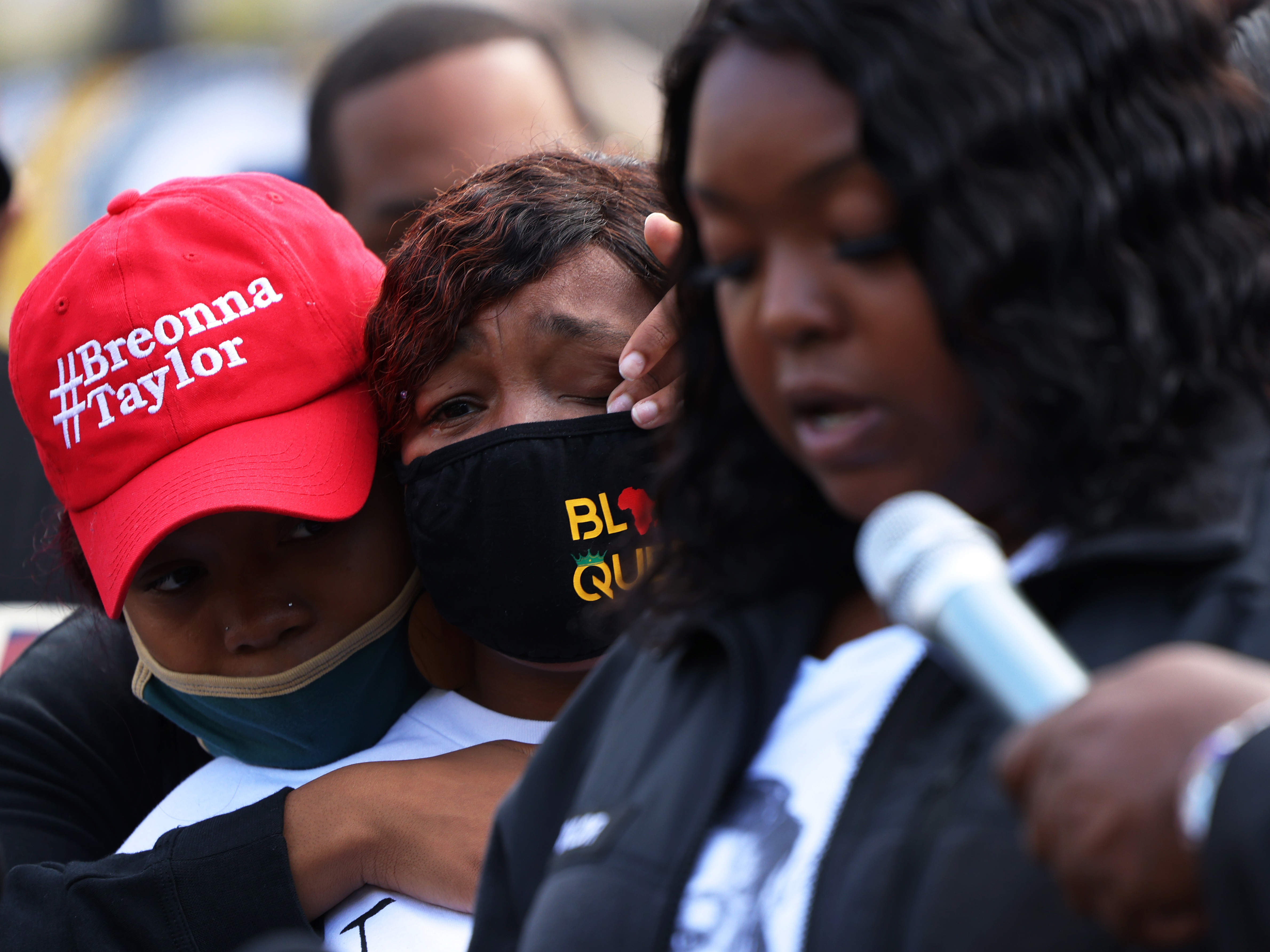 &quot;You didn't just rob me and my family, you robbed the world of a queen,&quot; Breonna Taylor's mother, Tamika Palmer, said in a statement read aloud Friday by Palmer's sister, Bianca Austin. In this photo, Ju'Niyah Palmer is seen wiping away tears from her mother's face. (Getty Images)