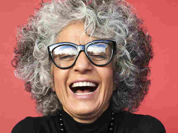 A woman laughing.