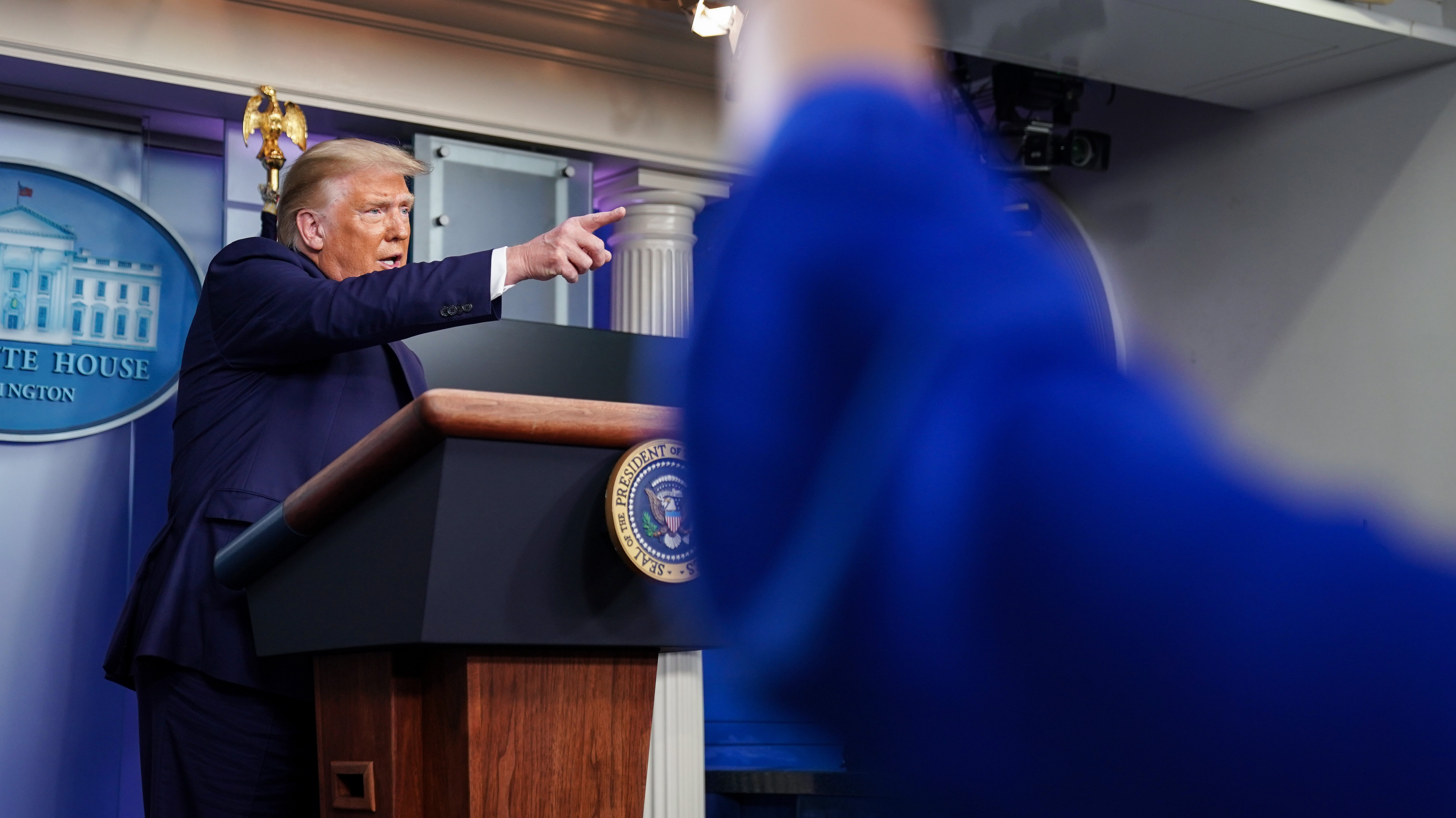 President Trump takes a question during a news conference at the White House on Sunday, where he dismissed reporting from <em>The New York Times</em> that he has paid little or no federal income taxes in recent years as &quot;fake news.&quot; (Getty Images)