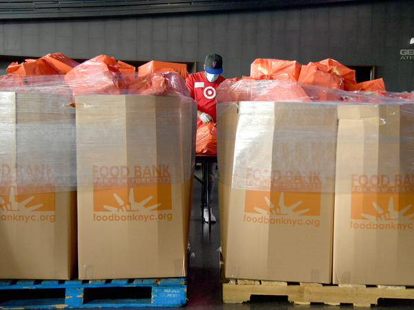 New Yorkers in need receive free produce, dry goods and meat at a Food Bank For New York City distribution event in July. Hunger is one of the most urgent — yet hidden — crises facing the nation.